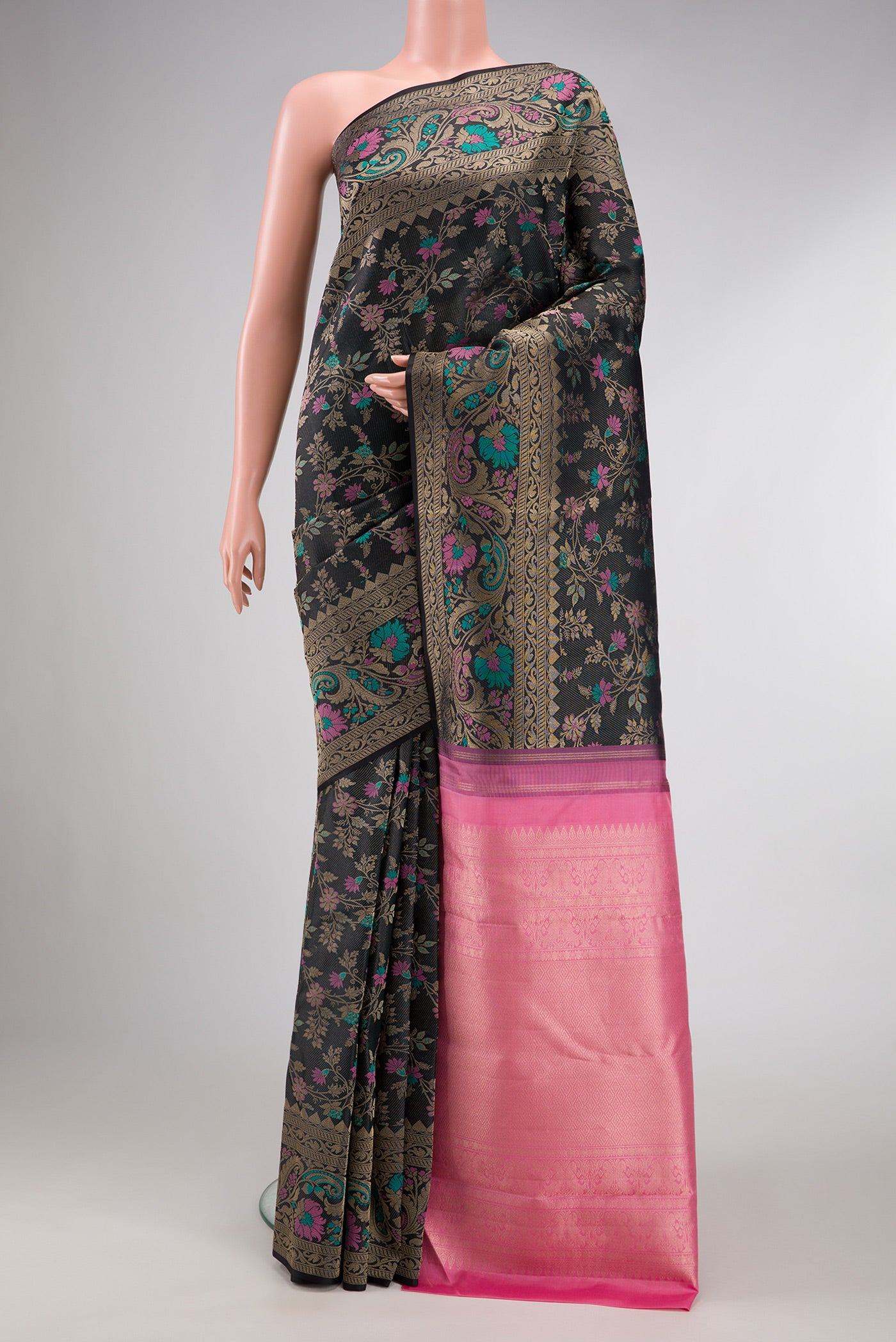 Black Dual Tone Kanchipuram Silk Saree with Zari Brocade on the body and Fancy Border.  displayed on a mannequin
