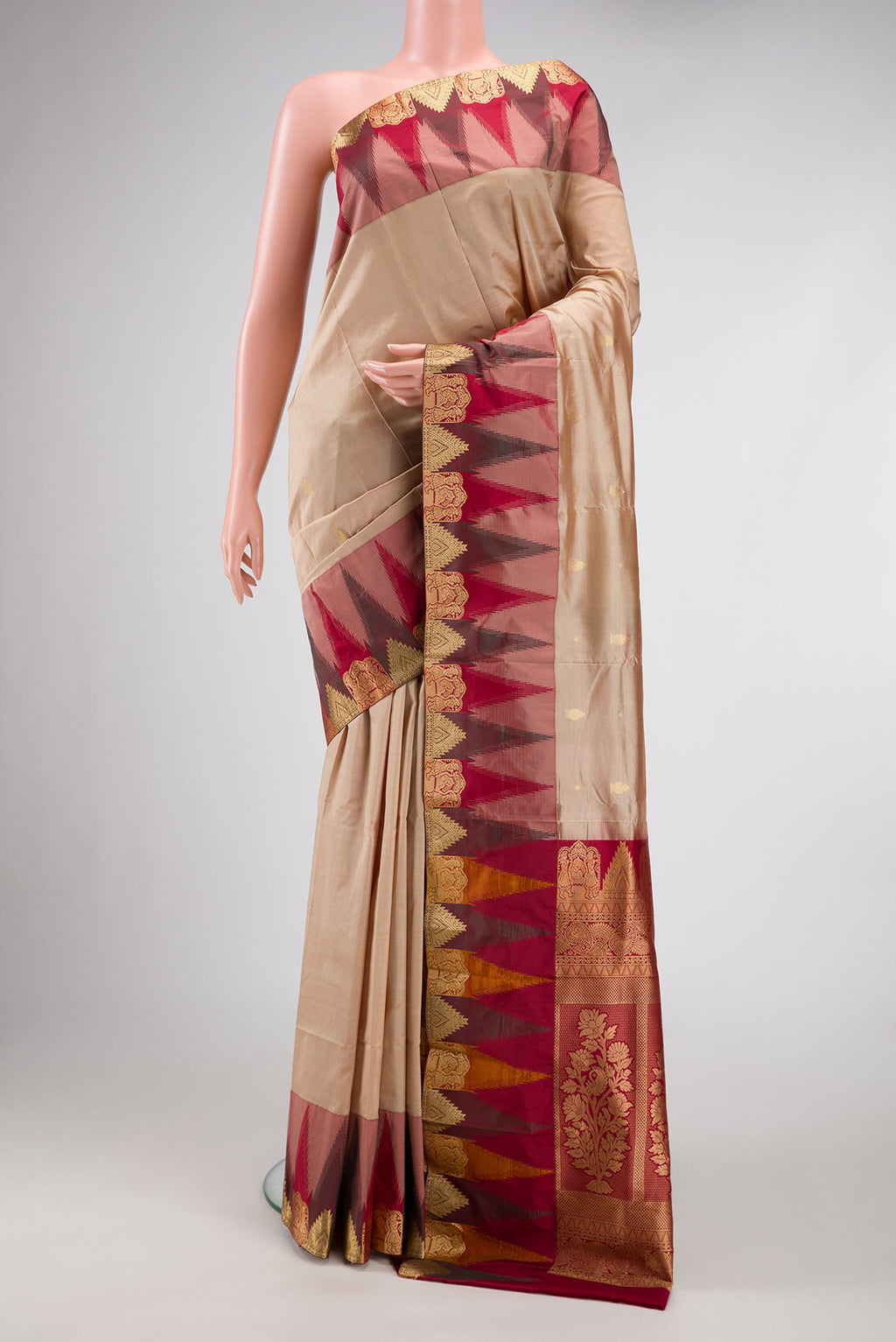 Beige Dual Tone Kanchipuram Silk Saree with Zari Butta on the body and Temple Border.  displayed on a mannequin