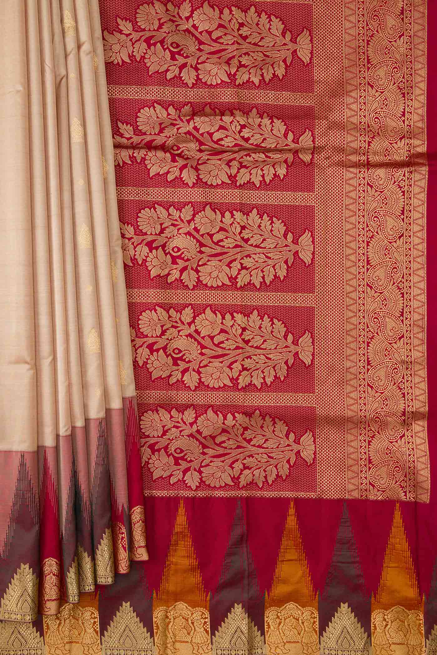 Pleats and pallu of Beige Dual Tone Kanchipuram Silk Saree with Zari Butta on the body and Temple Border. 