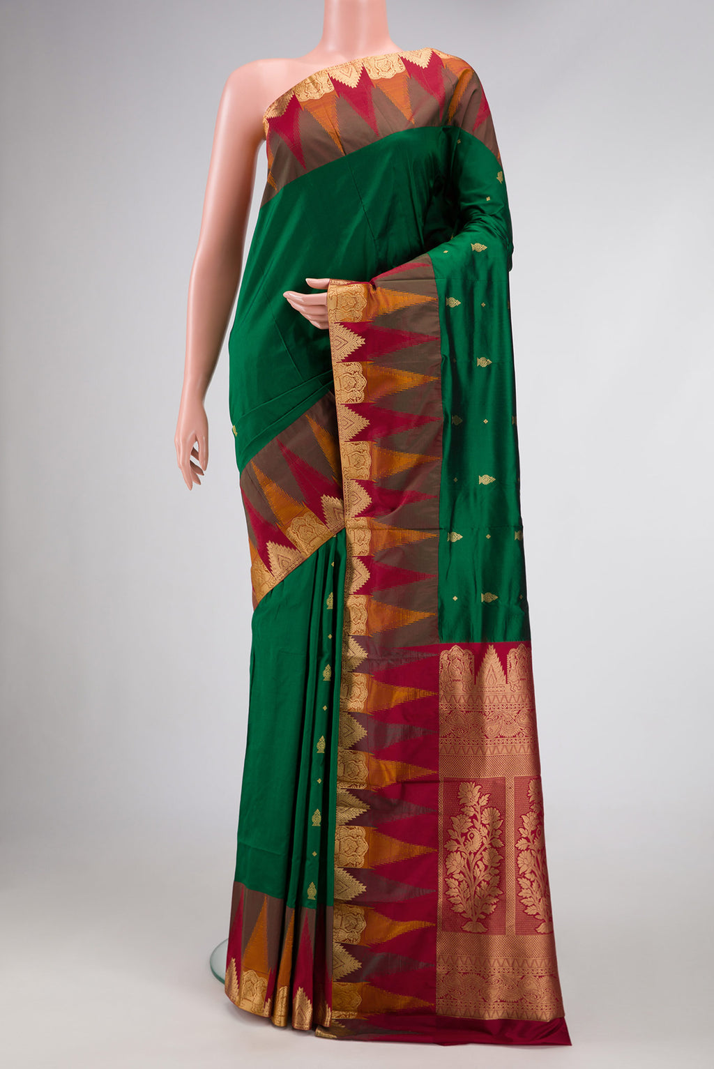 Bottle Green Dual Tone Kanchipuram Silk Saree with Zari Butta on the body and Temple Border.  displayed on a mannequin