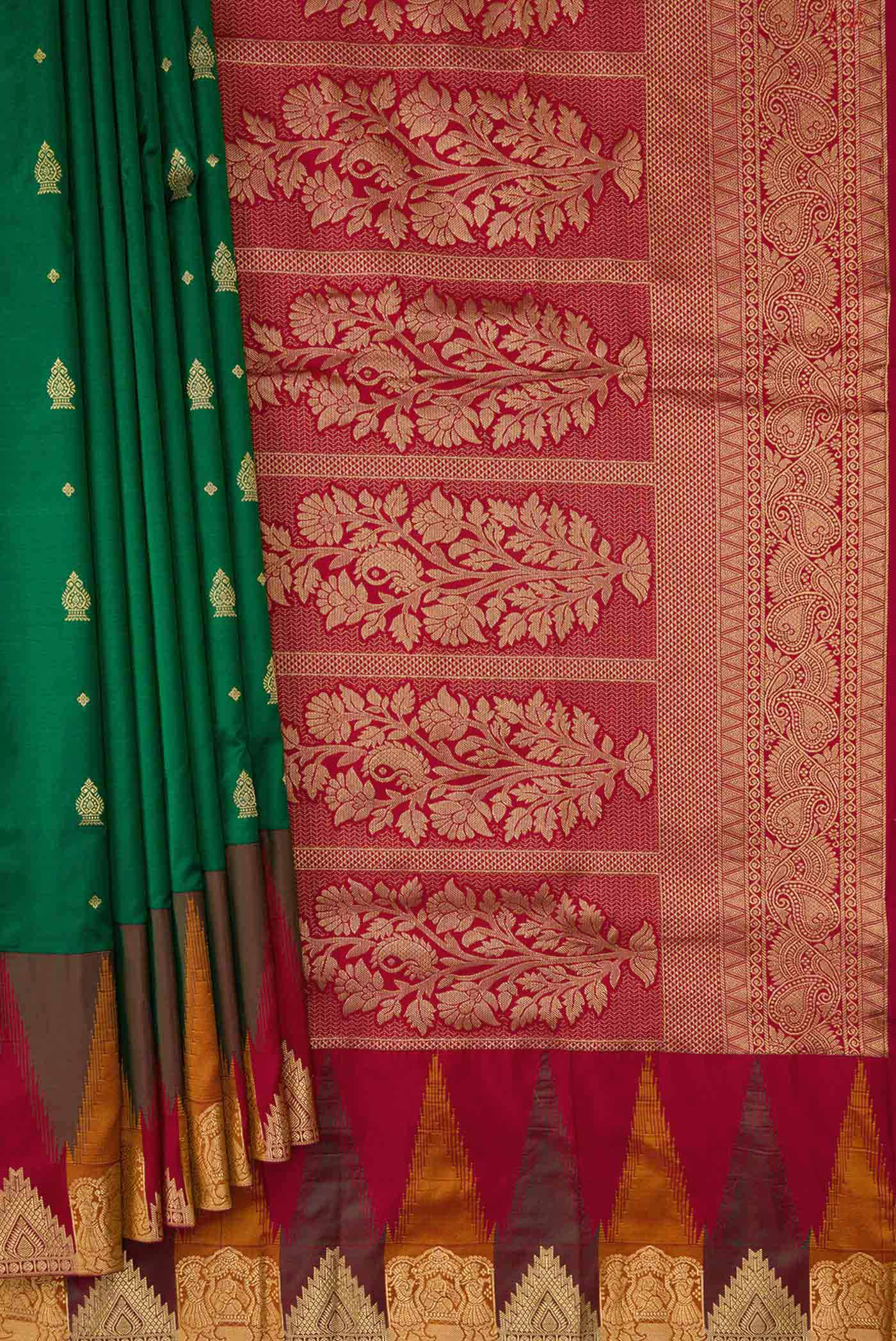 Pleats and pallu of Bottle Green Dual Tone Kanchipuram Silk Saree with Zari Butta on the body and Temple Border. 