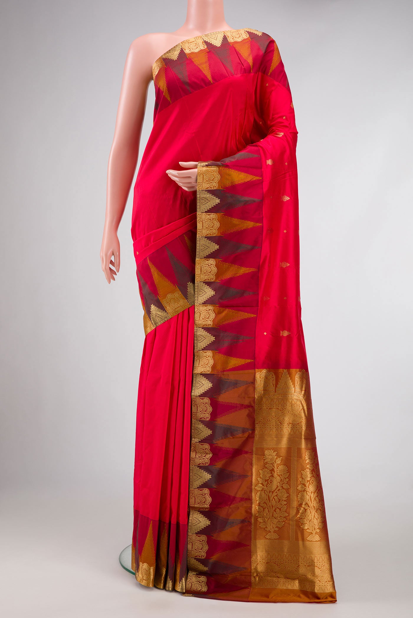 Red Dual Tone Kanchipuram Silk Saree with Zari Butta on the body and Temple Border.  displayed on a mannequin
