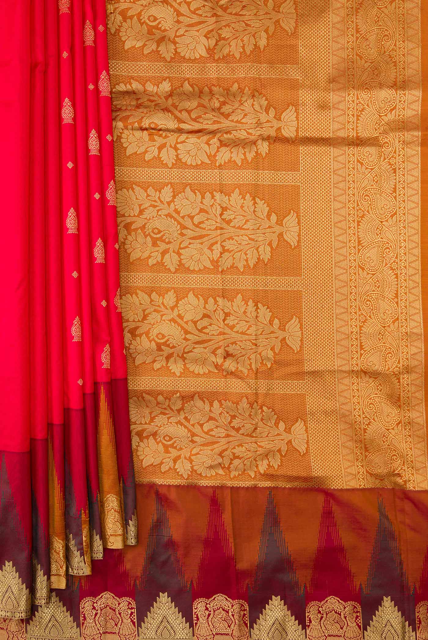 Pleats and pallu of Red Dual Tone Kanchipuram Silk Saree with Zari Butta on the body and Temple Border. 