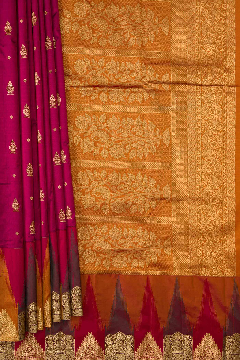 Pleats and pallu of Magenta Dual Tone Kanchipuram Silk Saree with Zari Butta on the body and Temple Border. 