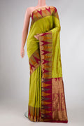 Parrot Green Dual Tone Kanchipuram Silk Saree with Zari Butta on the body and Temple Border.  displayed on a mannequin