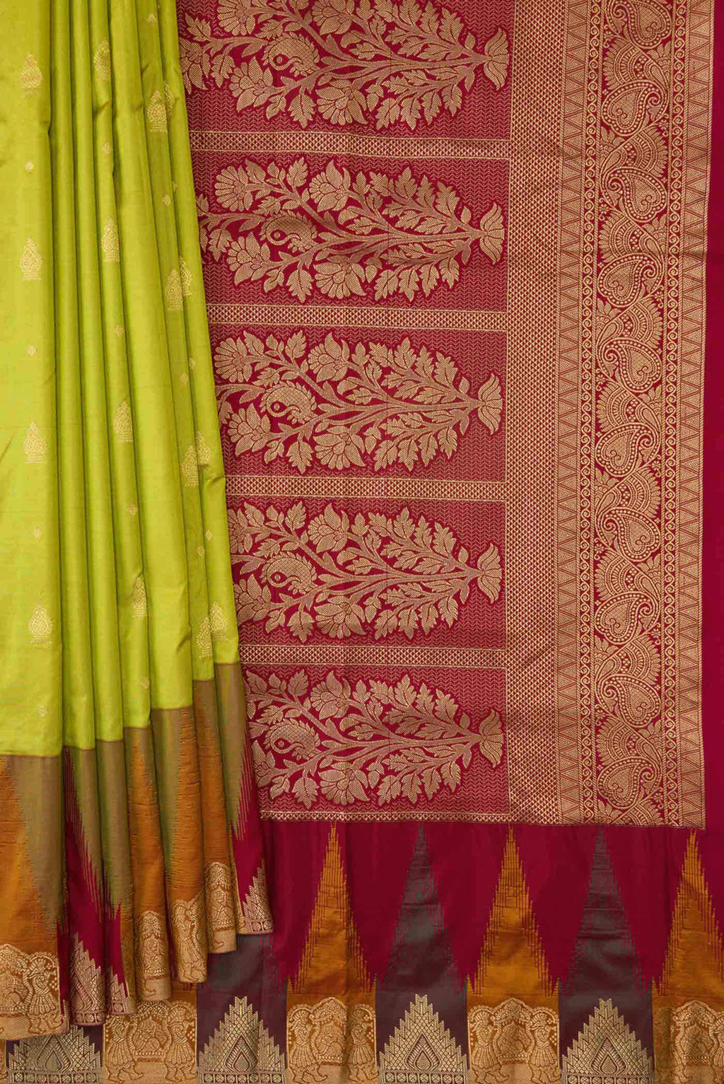 Pleats and pallu of Parrot Green Dual Tone Kanchipuram Silk Saree with Zari Butta on the body and Temple Border. 