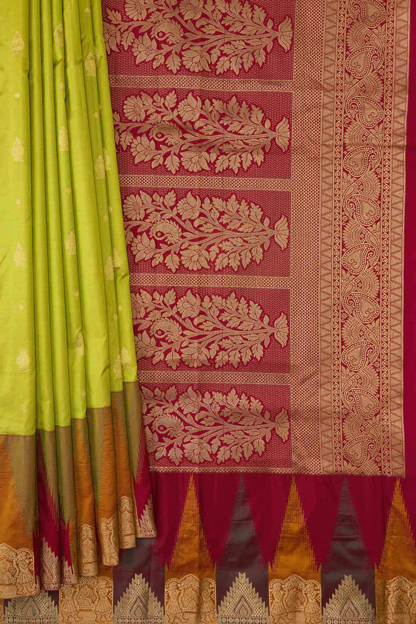Pleats and pallu of Parrot Green Dual Tone Kanchipuram Silk Saree with Zari Butta on the body and Temple Border. 