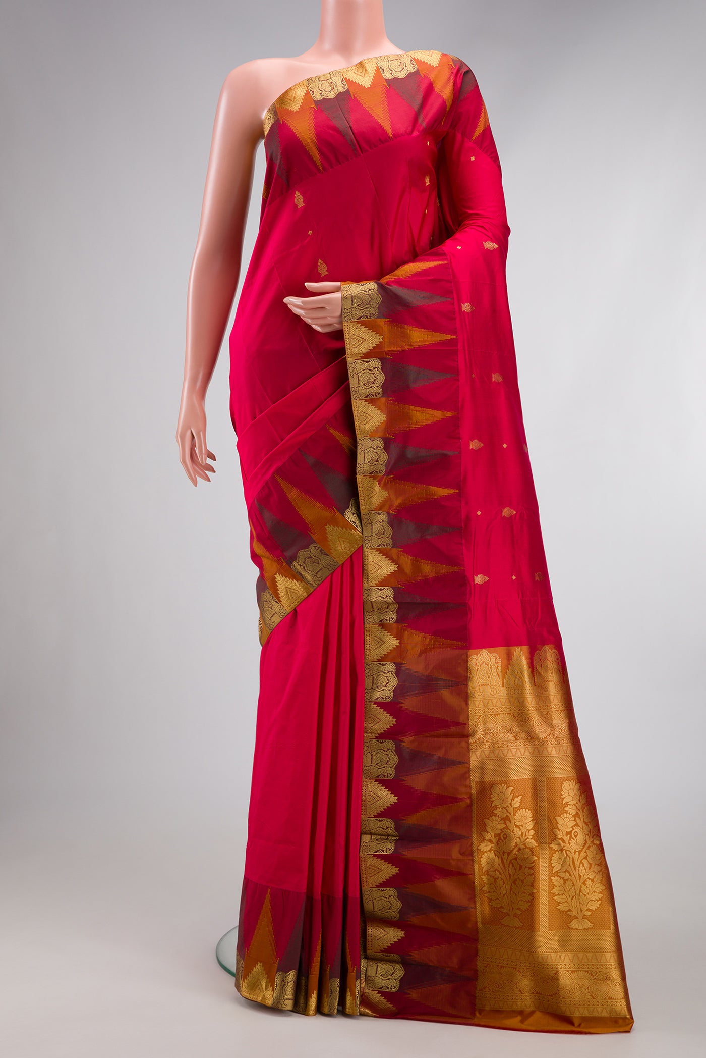 Red Dual Tone Kanchipuram Silk Saree with Zari Butta on the body and Temple Border.  displayed on a mannequin