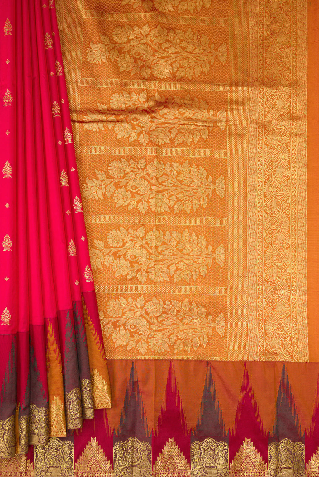 Pleats and pallu of Red Dual Tone Kanchipuram Silk Saree with Zari Butta on the body and Temple Border. 