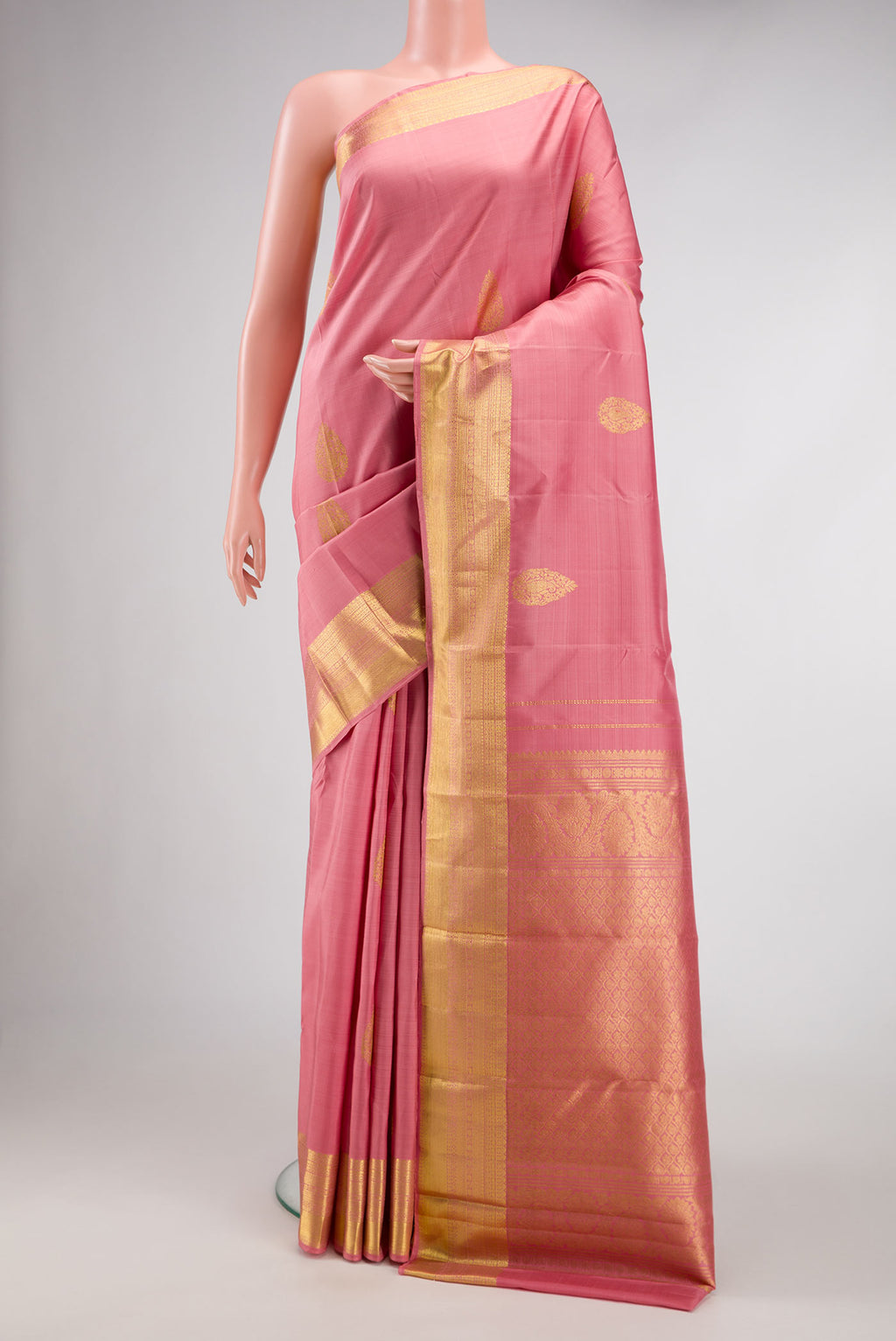 Pink Dual Tone Kanjivaram Silk Saree with Zari Butta on the body and Zari Border.  displayed on a mannequin