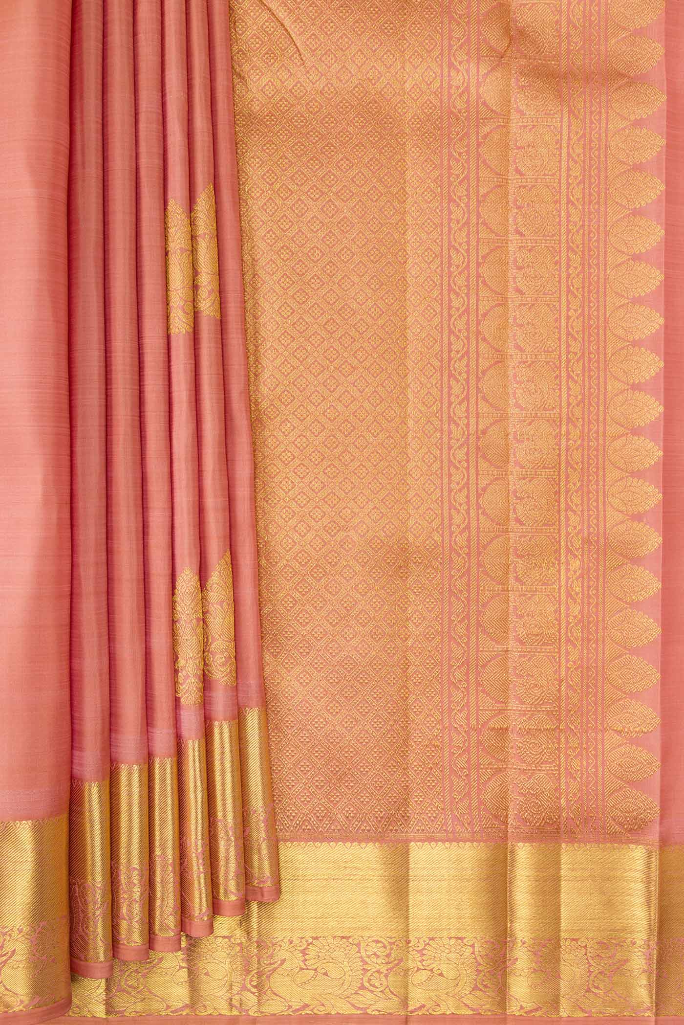Pleats and pallu of Rose Gold Dual Tone Kanjivaram Silk Saree with Zari Butta on the body and Zari Border. 