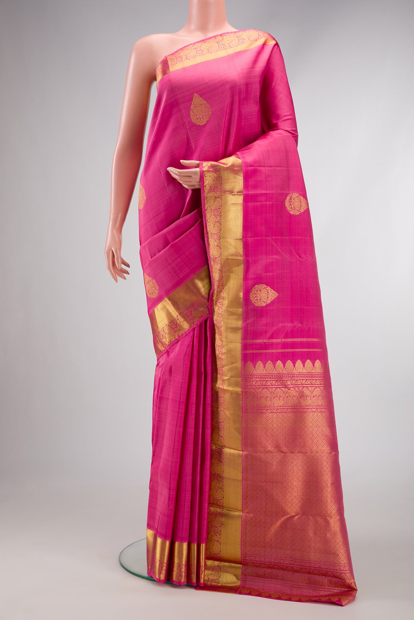 Pink Dual Tone Kanjivaram Silk Saree with Zari Butta on the body and Zari Border.  displayed on a mannequin
