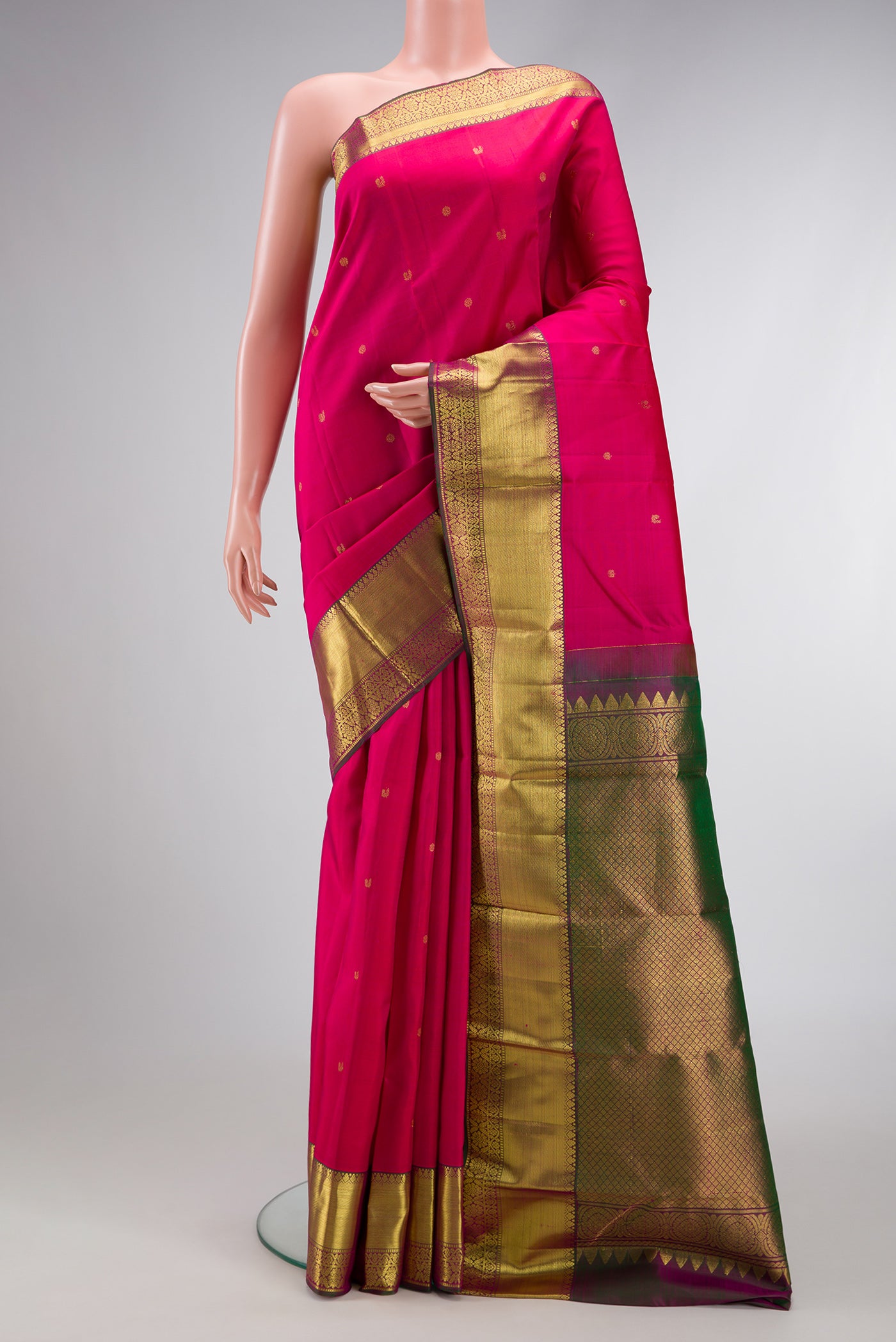 Pink Dual Tone Kanjivaram Silk Saree with Zari Butta on the body and Zari Border.  displayed on a mannequin