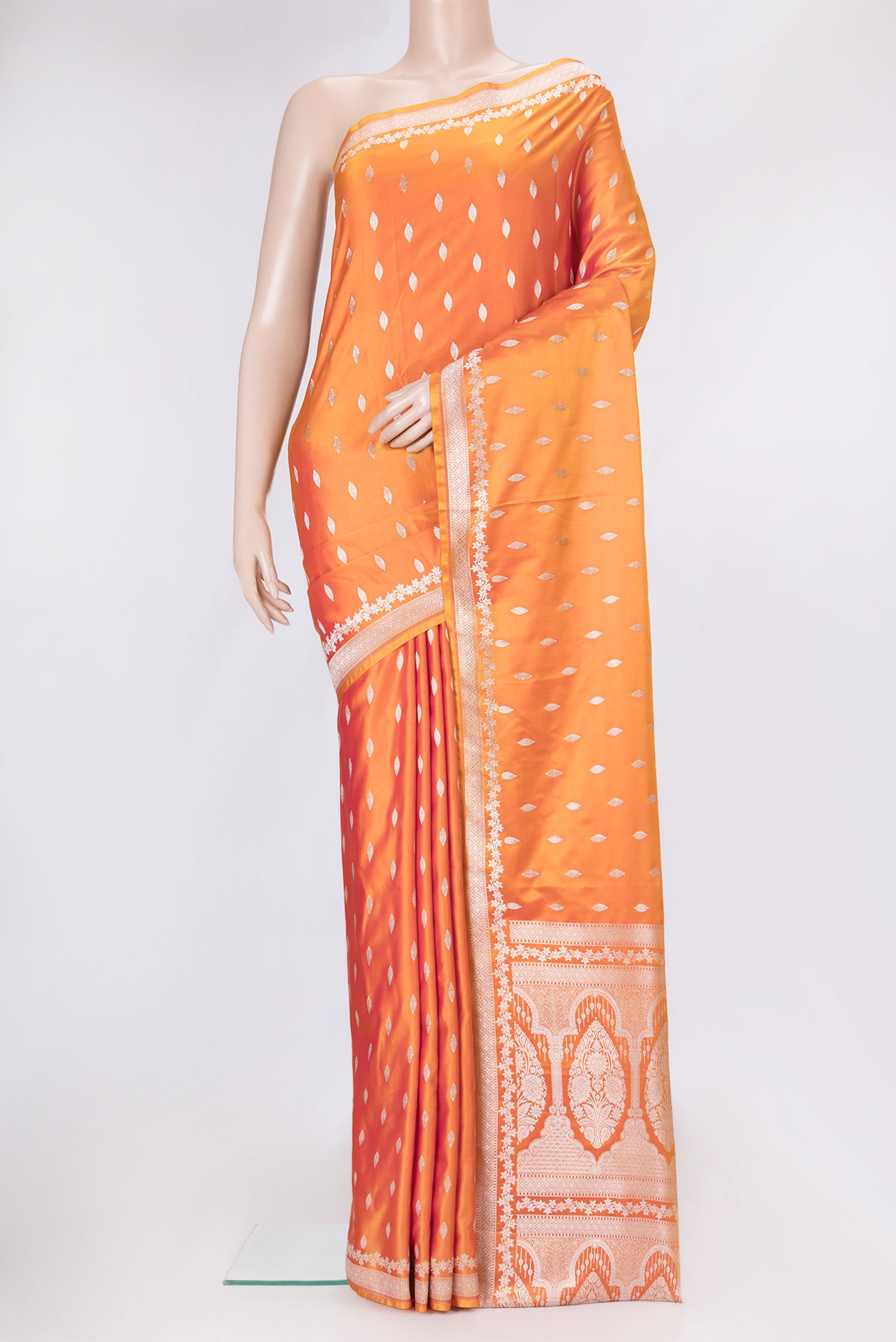 Orange Dual Tone Blended Banarasi Silk Saree with Zari Butta on the body and Zari Border.  displayed on a mannequin