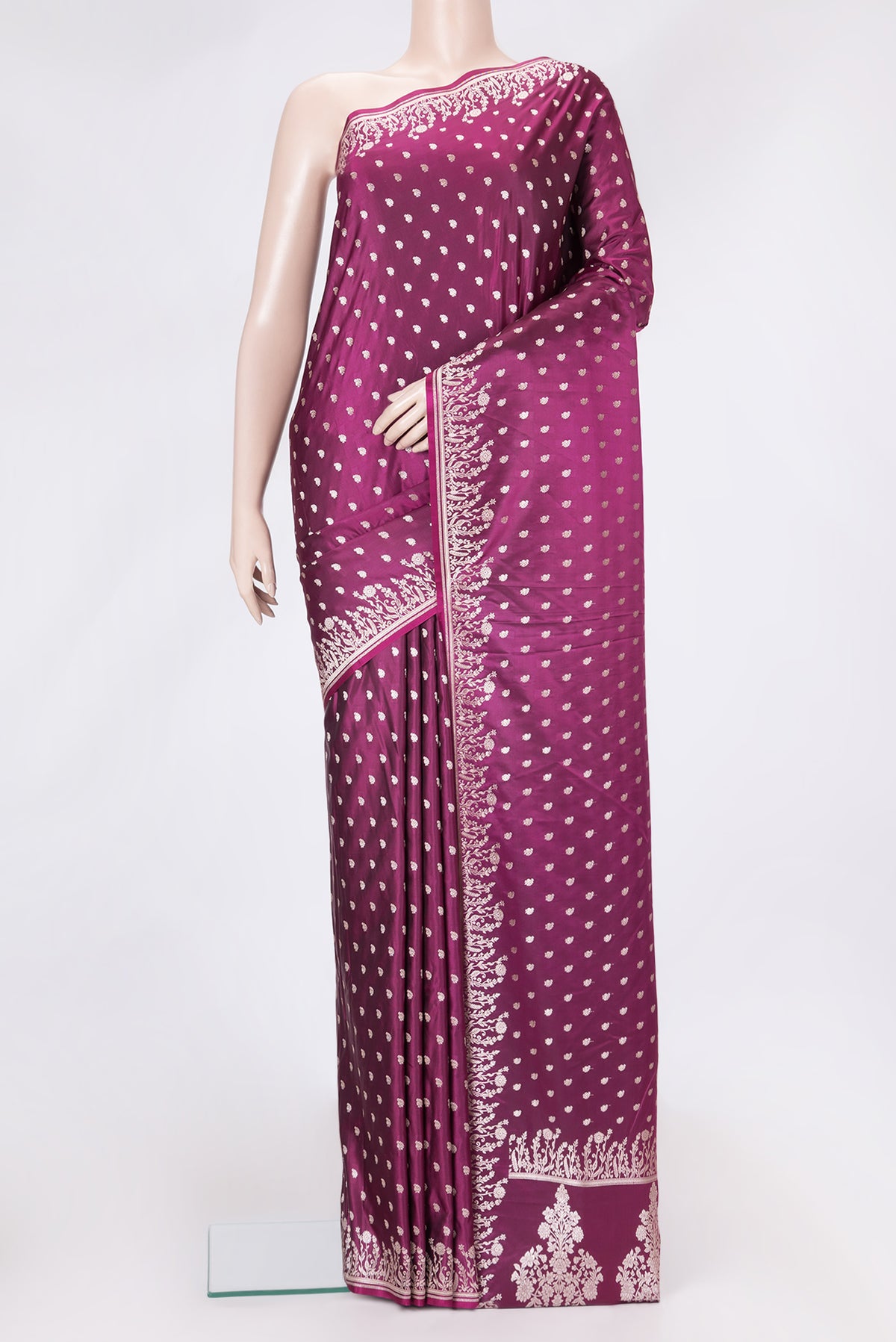 Magenta Dual Tone Banarasi Silk Saree with Zari Butta on the body and Fancy Border.  displayed on a mannequin