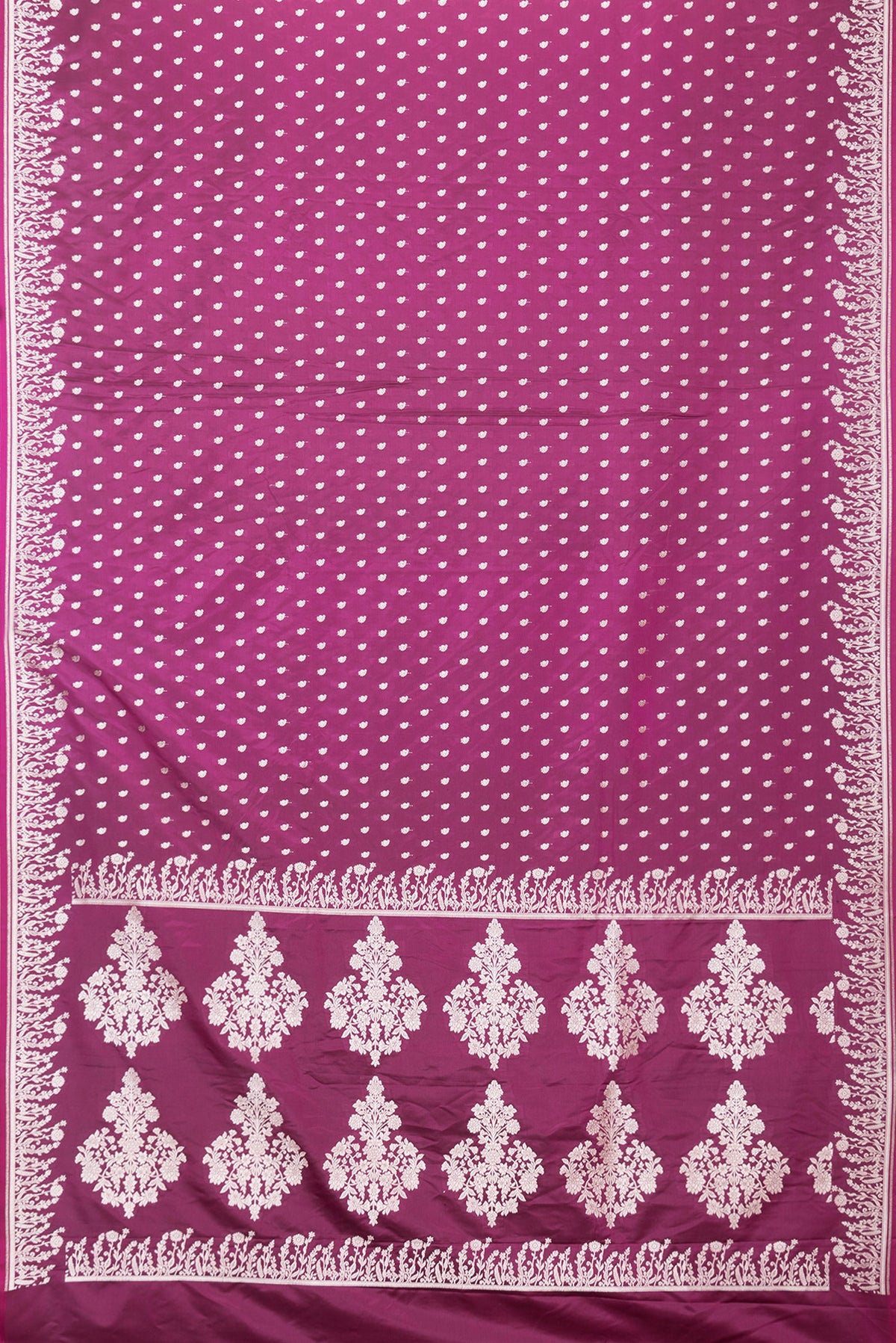 Flat view of Magenta Dual Tone Banarasi Silk Saree with Zari Butta on the body and Fancy Border. 