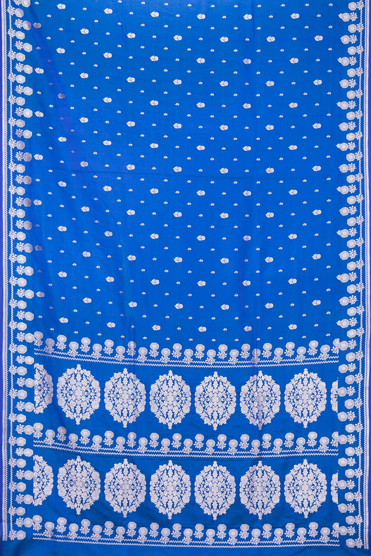Flat view of Royal Blue Dual Tone Blended Banarasi Silk Saree with Zari Butta on the body and Zari Border. 