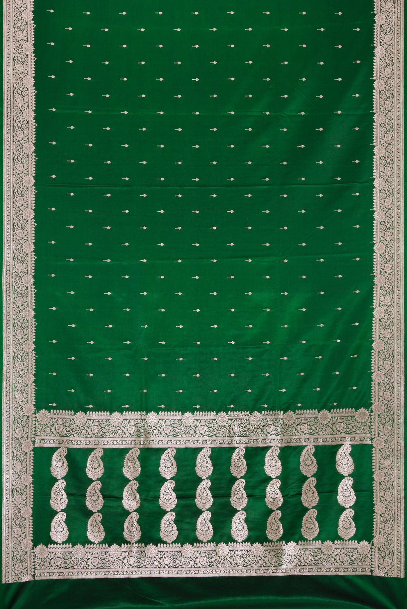 Bottle Green Dual Tone Banarasi Silk Saree with Zari Butta on the body and Zari Border.  displayed on a mannequin