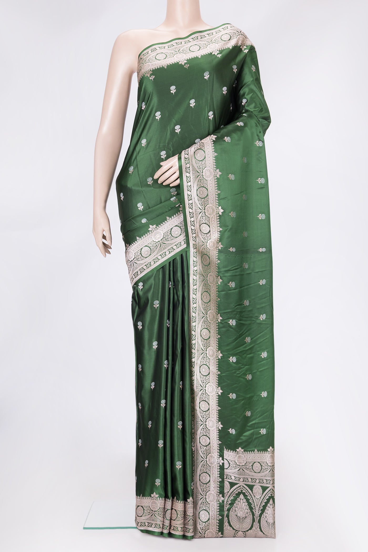 Bottle Green Dual Tone Banarasi Silk Saree with Zari Butta on the body and Zari Border.  displayed on a mannequin