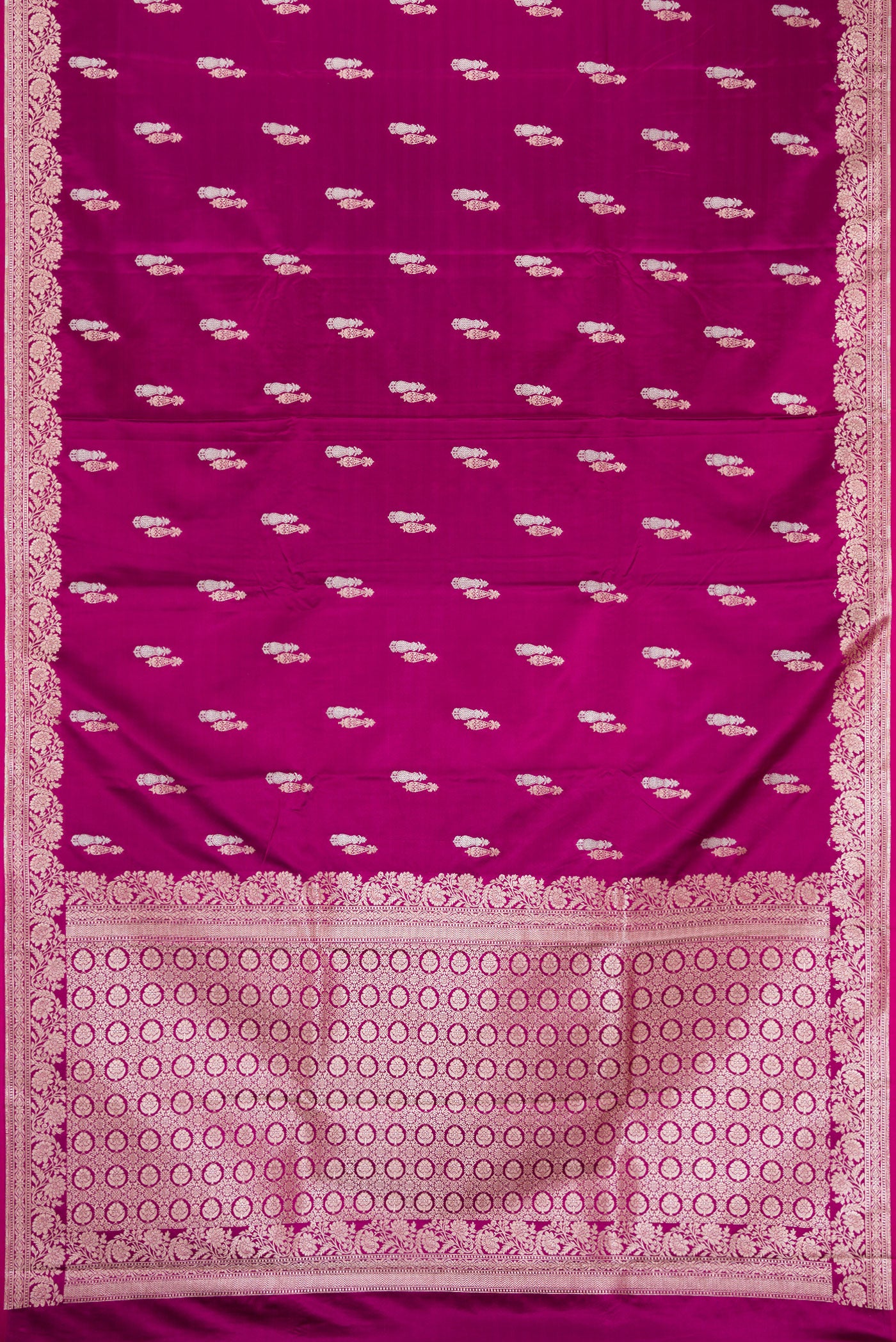 Burgundy Dual Tone Banarasi Silk Saree with Zari Butta on the body and Zari Border.  displayed on a mannequin