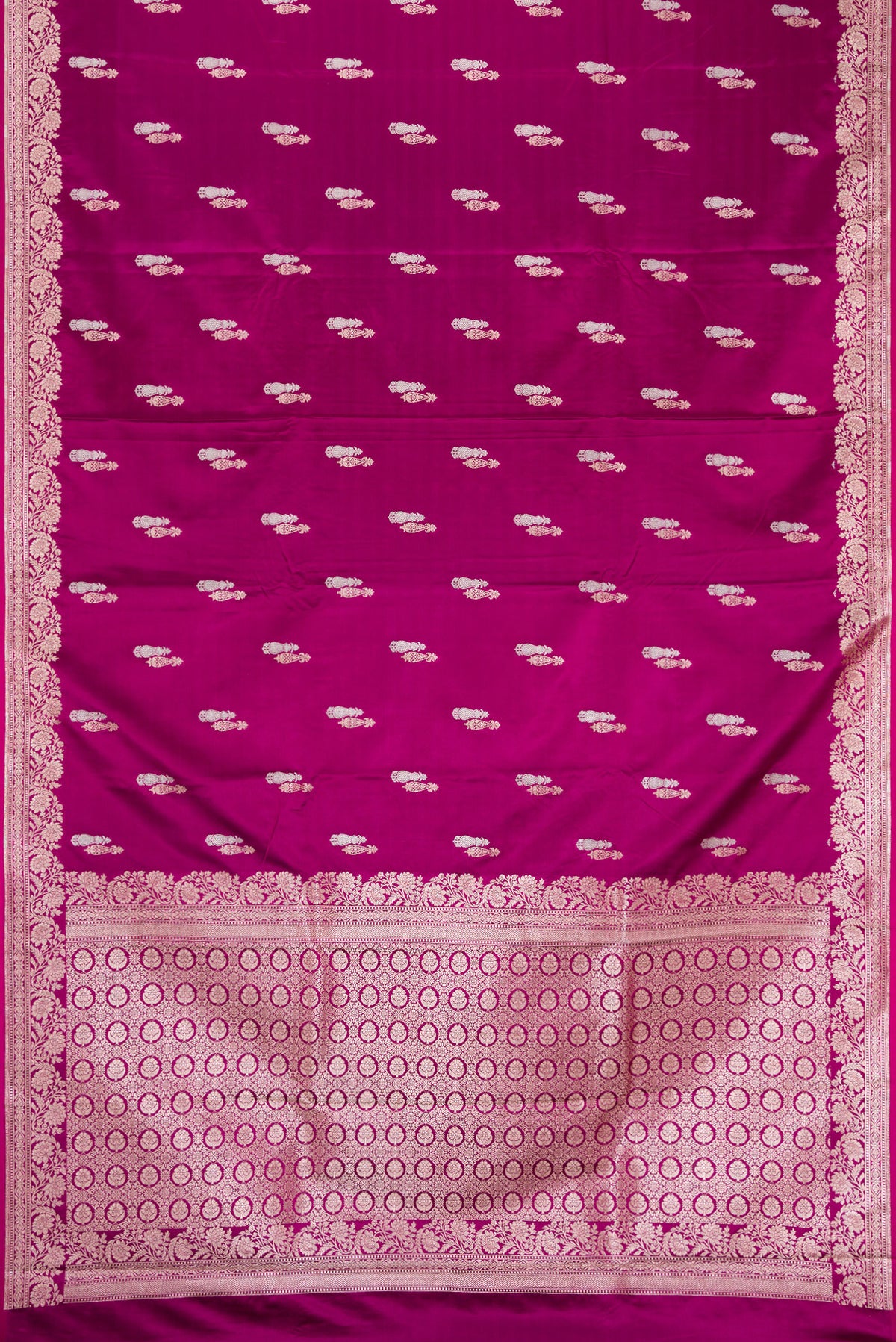 Flat view of Burgundy Dual Tone Banarasi Silk Saree with Zari Butta on the body and Zari Border. 
