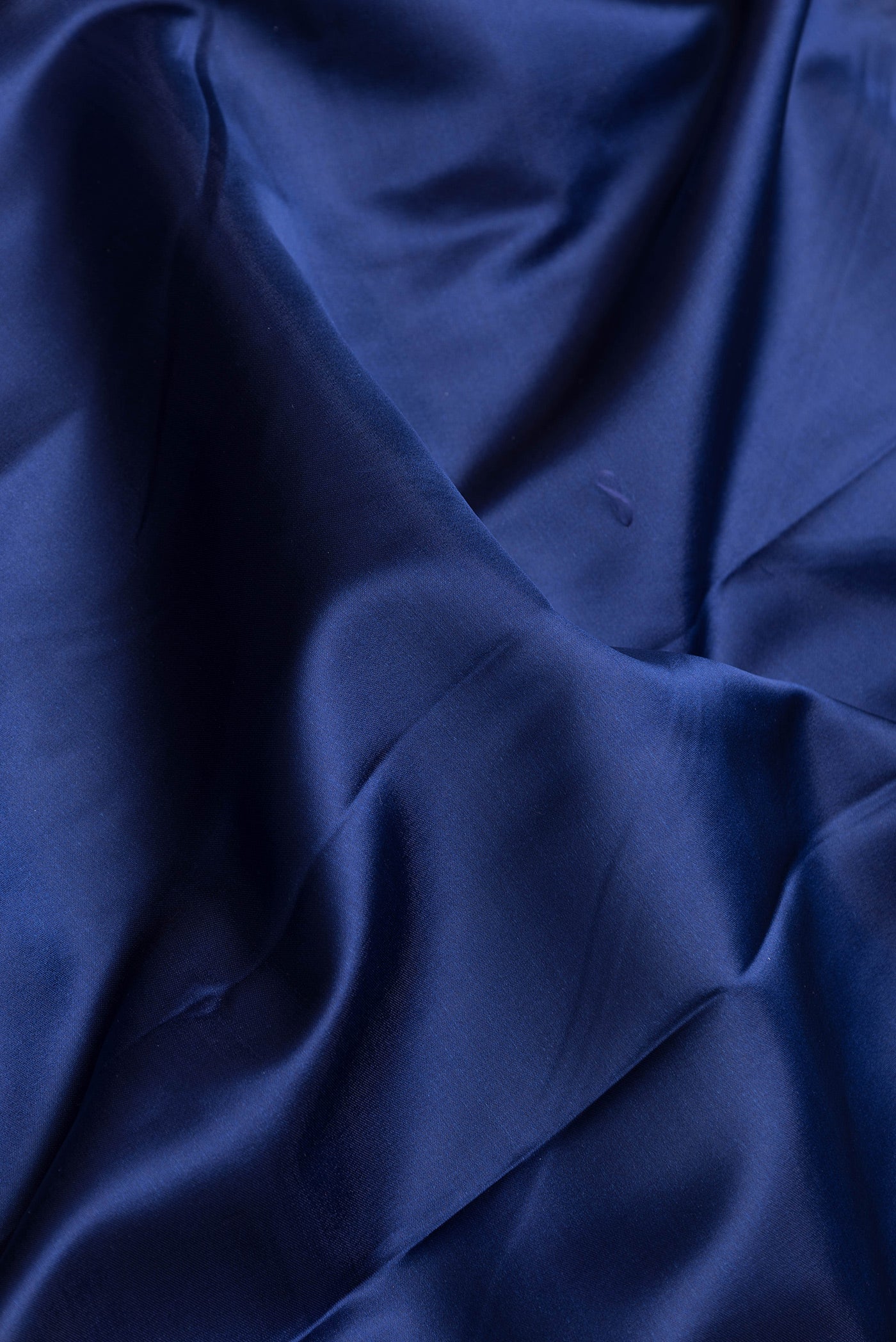 Close up of Navy Blue Dual Tone Blended Banarasi Silk Saree with Plain Body and Fancy Border.  displaying folds