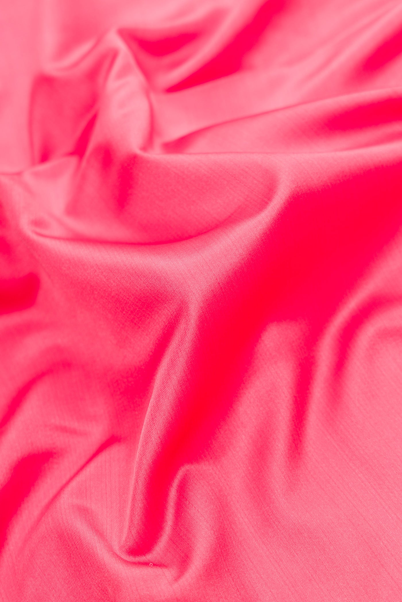 Close up of Pink Dual Tone Banarasi Silk Saree with Plain Body and Fancy Border.  displaying folds