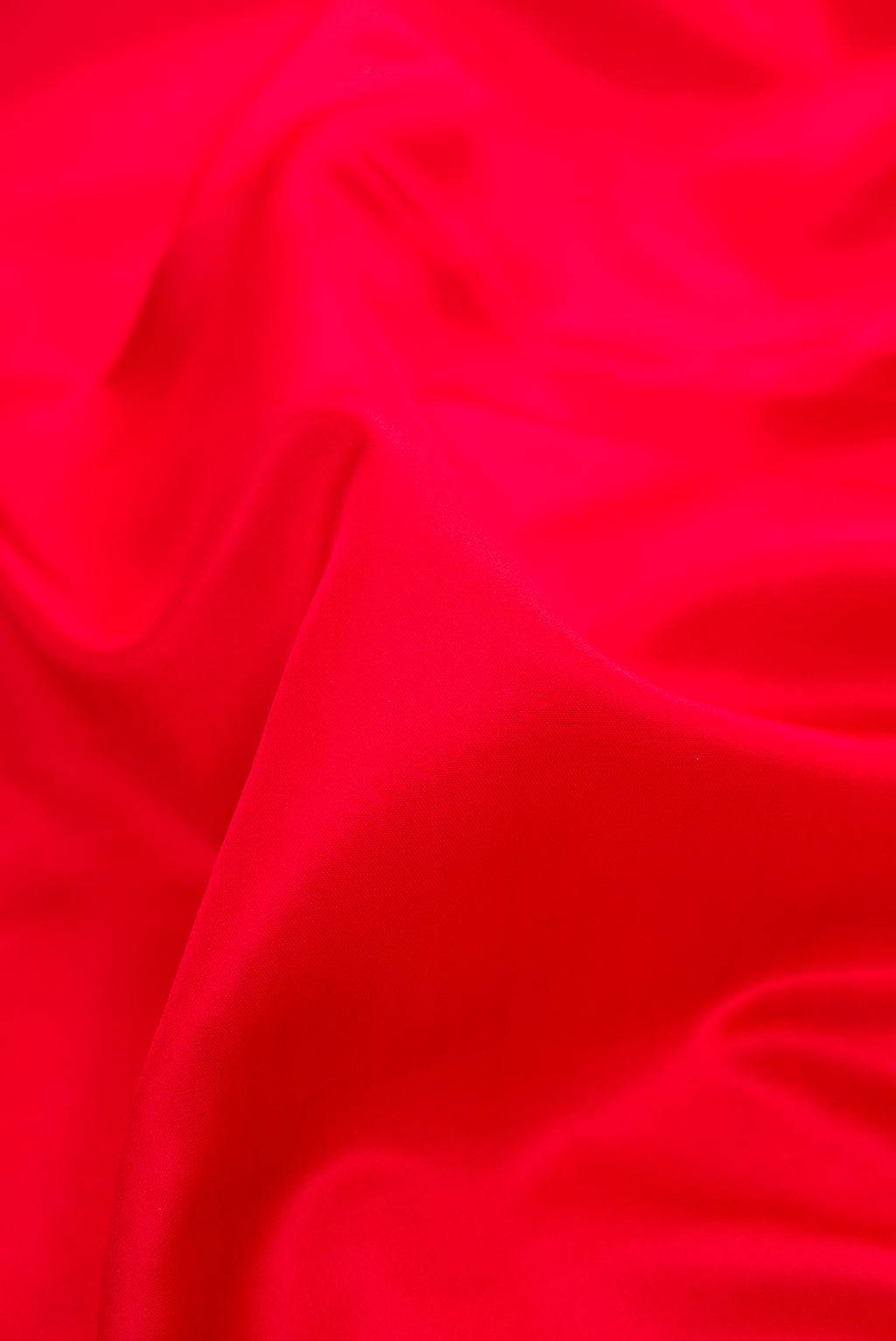 Close up of Red Dual Tone Banarasi Silk Saree with Plain Body and Fancy Border.  displaying folds