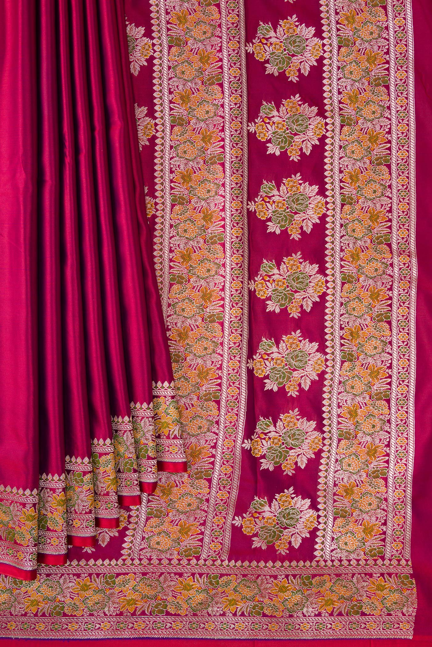 Pleats and pallu of Maroon Dual Tone Banarasi Silk Saree with Plain Body and Fancy Border. 