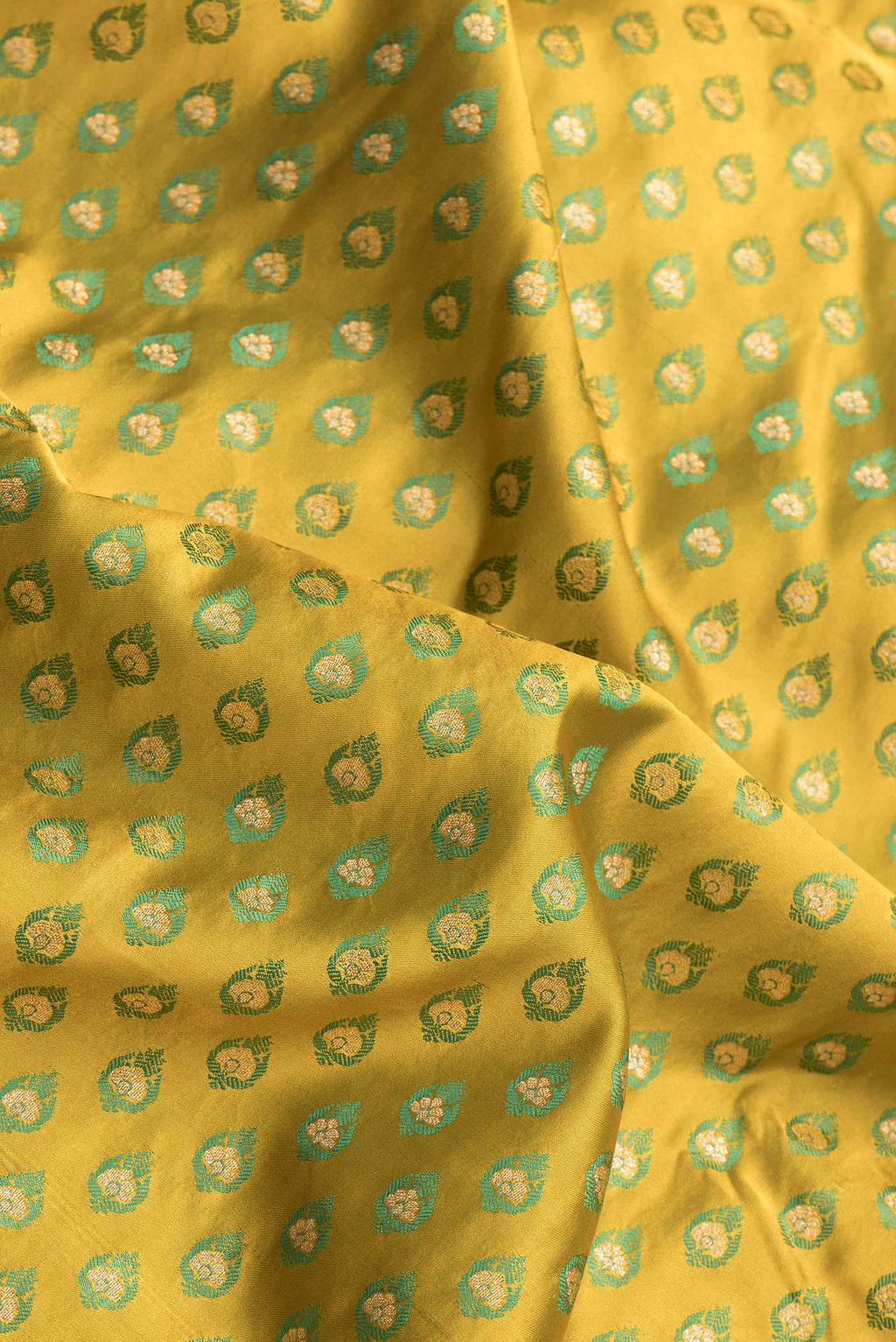Close up of Mehandi Green Dual Tone Blended Banarasi Silk Saree with Zari And Thread Butta on the body and Zari Border.  displaying folds