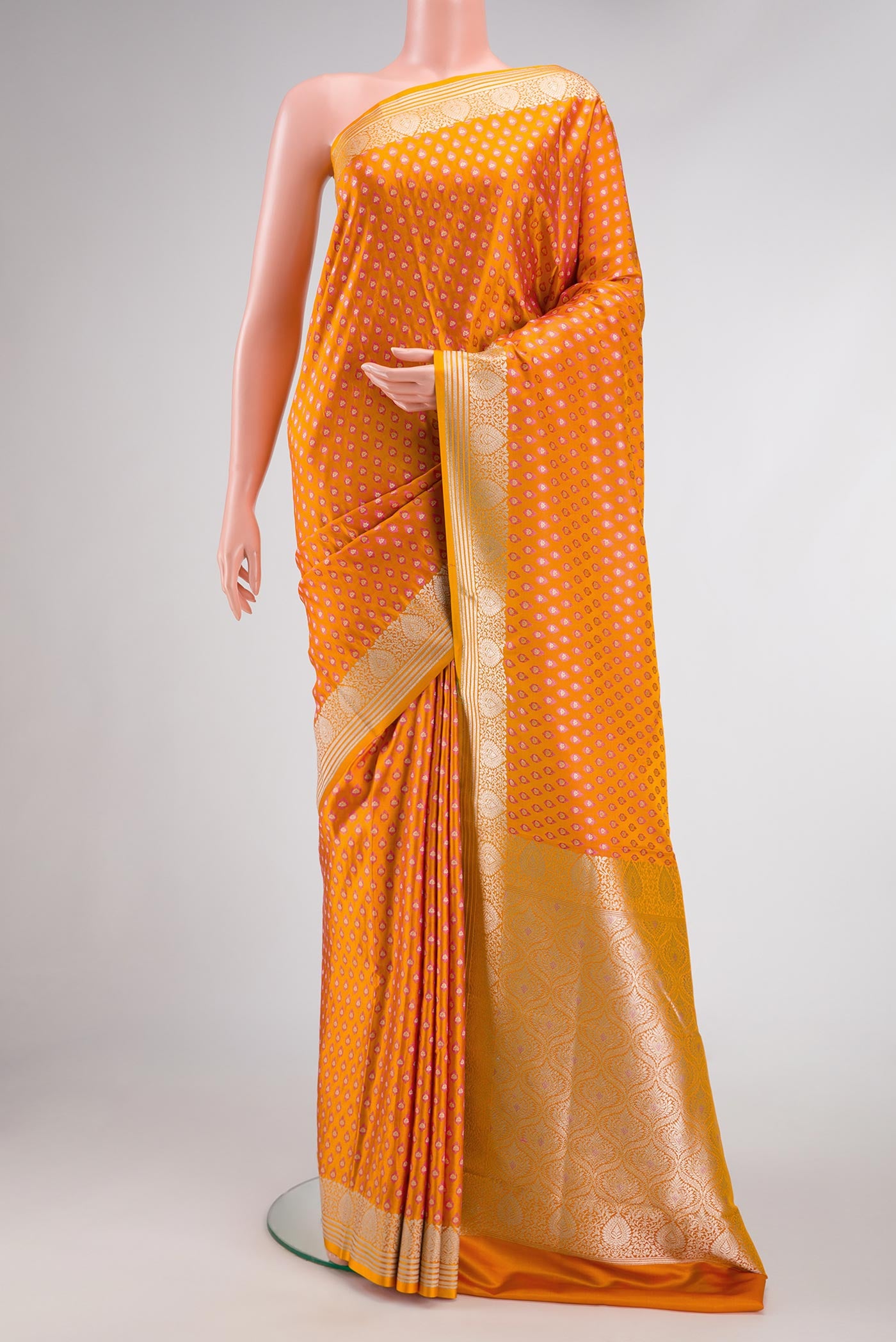 Mustard Dual Tone Blended Banarasi Silk Saree with Zari Butta on the body and Zari Border.  displayed on a mannequin