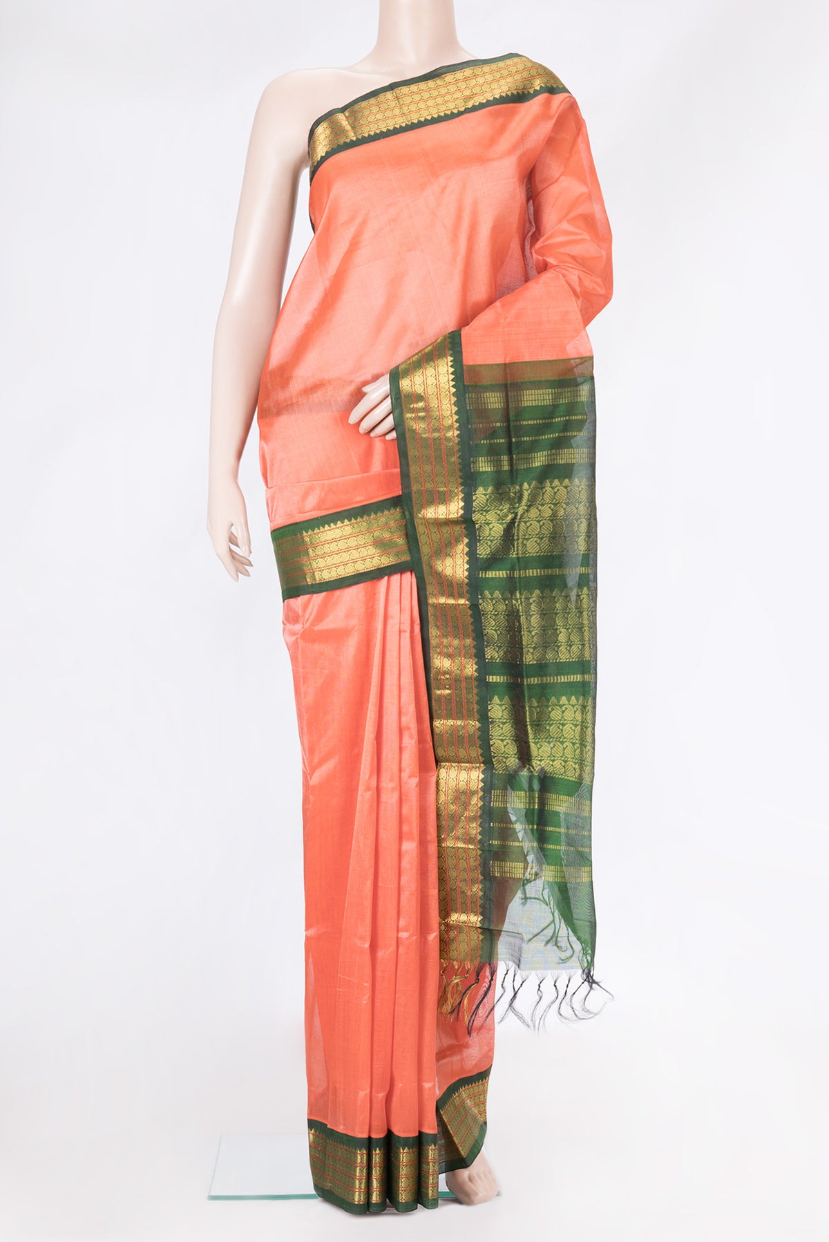 Coral Silk Cotton Saree with Plain Body and Zari Border.  displayed on a mannequin
