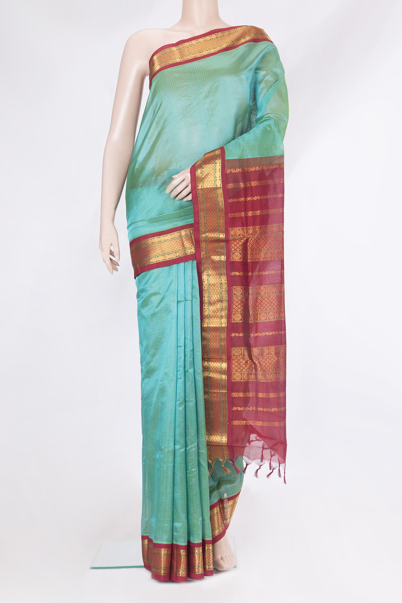 Peacock Blue Silk Cotton Saree with Checked design on the body and Zari Border.  displayed on a mannequin