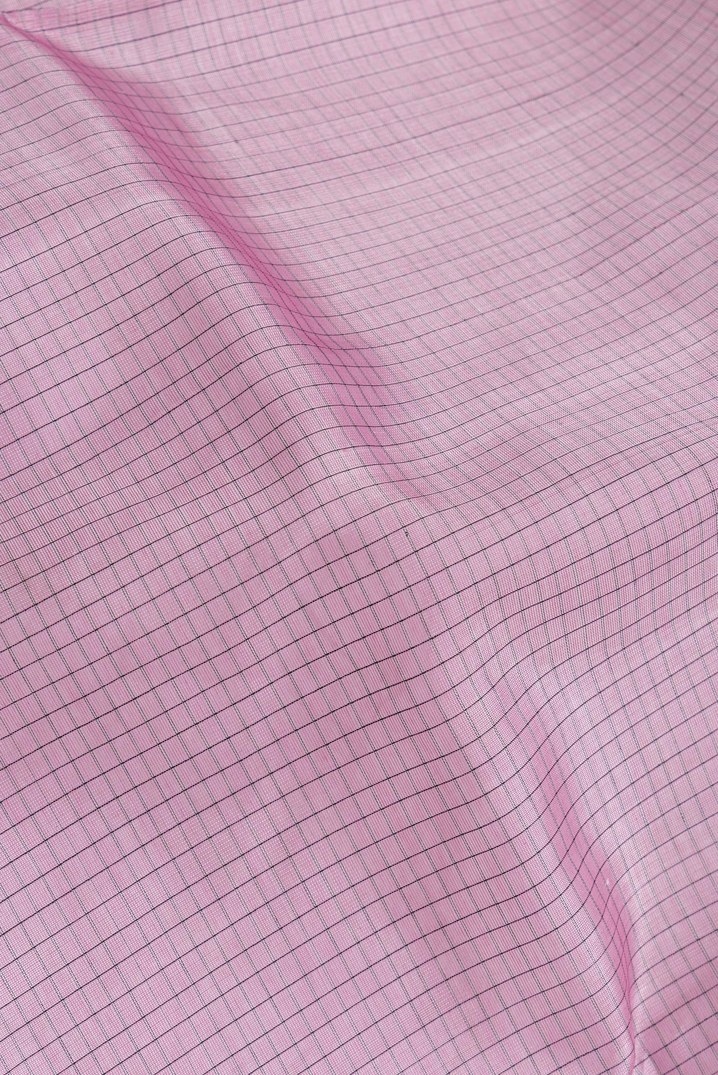 Close up of Lavender Dual Tone Silk Cotton Saree with Zari Butta on the body and Zari Border.  displaying folds