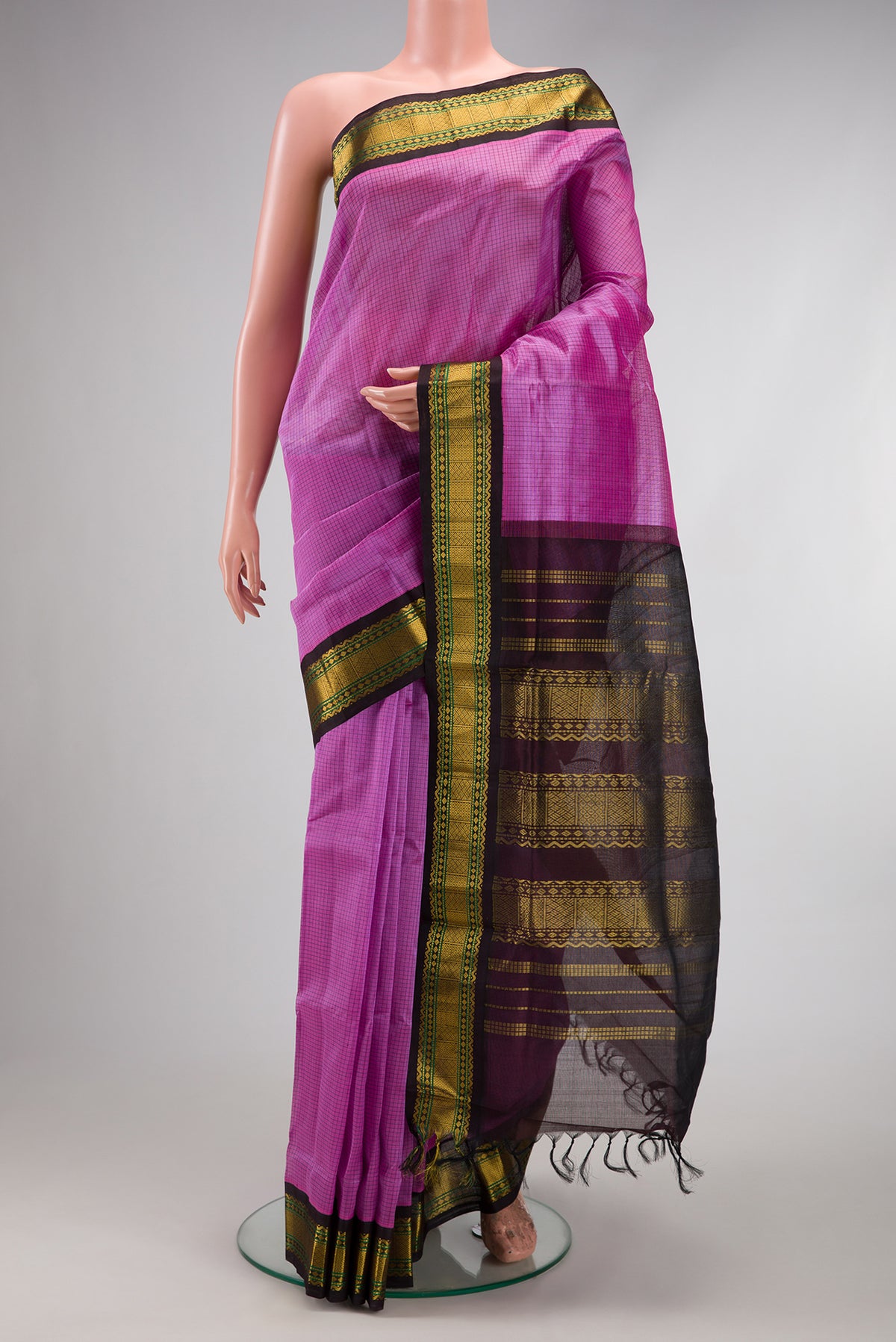 Lavender Silk Cotton Saree with Checked design on the body and Zari Border.  displayed on a mannequin