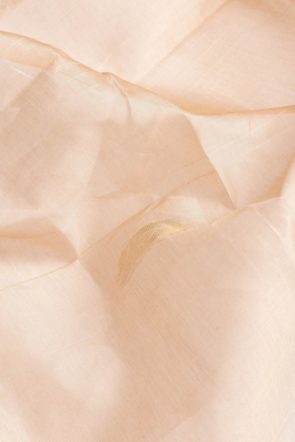 Close up of Caramel Dual Tone Silk Cotton Saree with Zari Butta on the body and Zari Border.  displaying folds