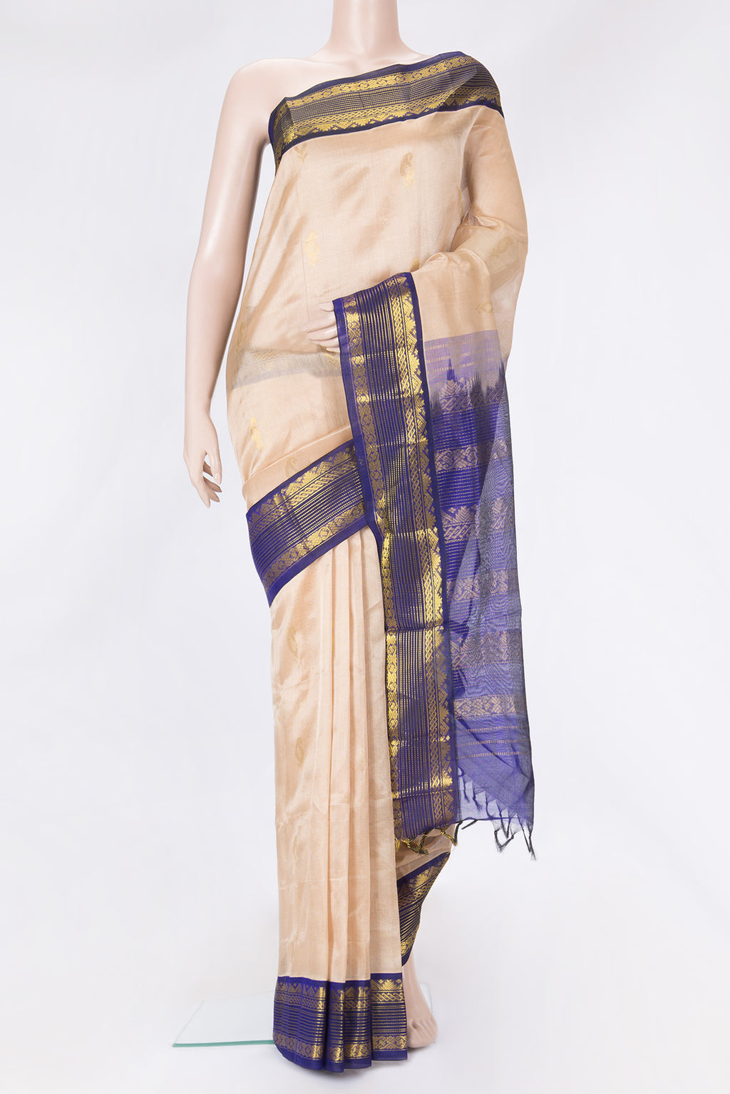 Caramel Dual Tone Silk Cotton Saree with Zari Butta on the body and Zari Border.  displayed on a mannequin