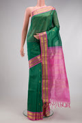 Green Silk Cotton Saree with Zari Butta on the body and Zari Border.  displayed on a mannequin
