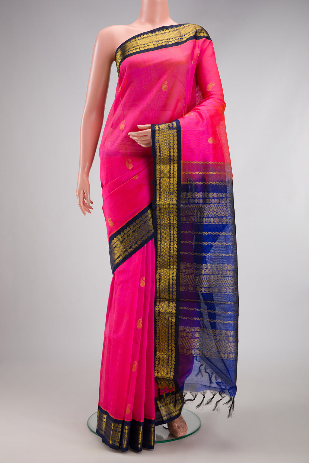 Pink Silk Cotton Saree with Zari Butta on the body and Zari Border.  displayed on a mannequin