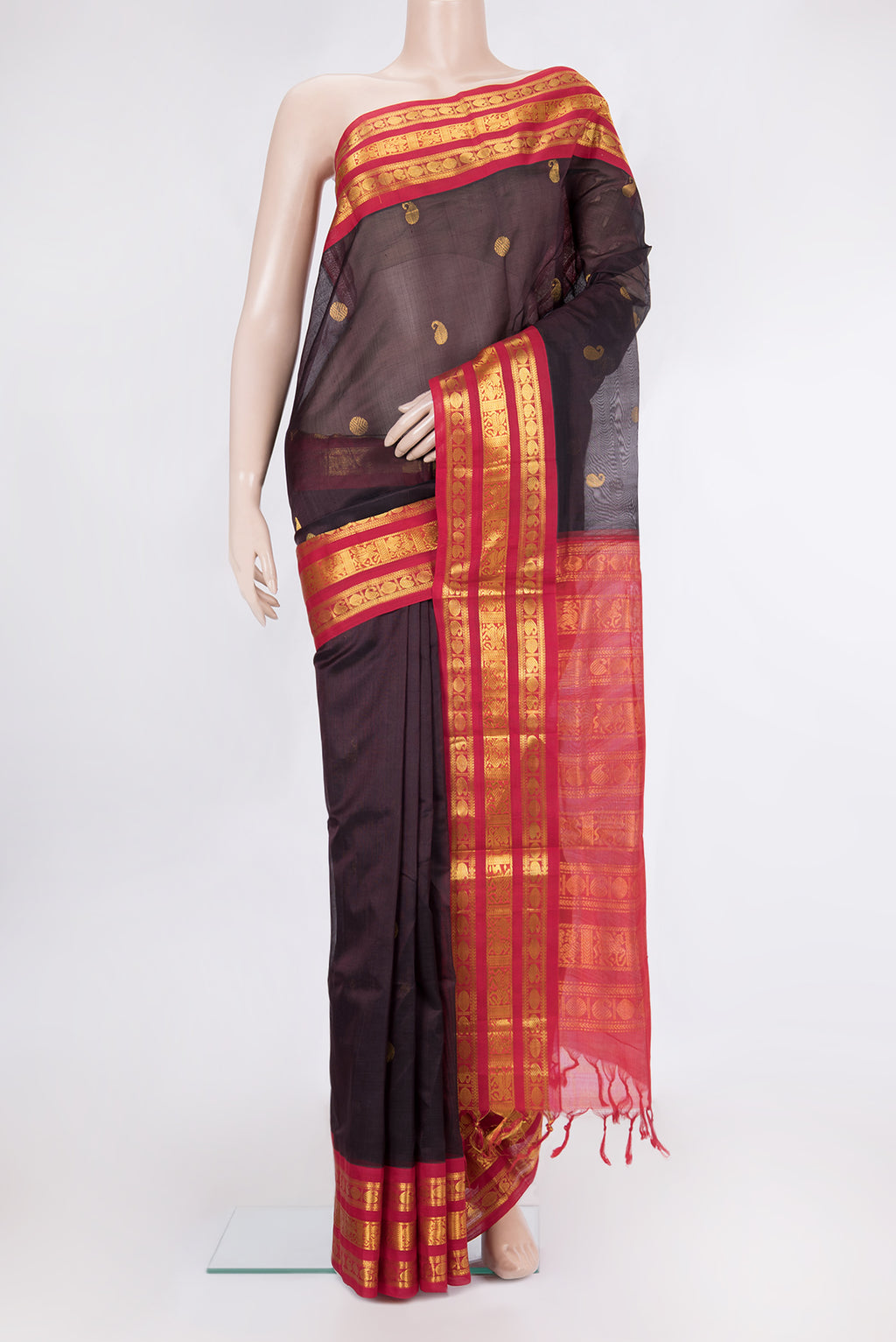 Coffee Brown Silk Cotton Saree with Zari Butta on the body and Zari Border.  displayed on a mannequin