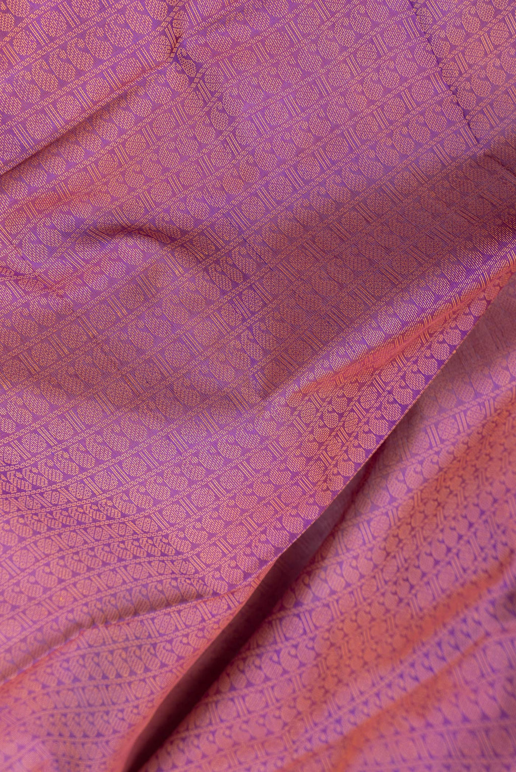Close up of Purple Dual Tone Cotton Saree with Jacquard design on the body and Thread Border.  displaying folds