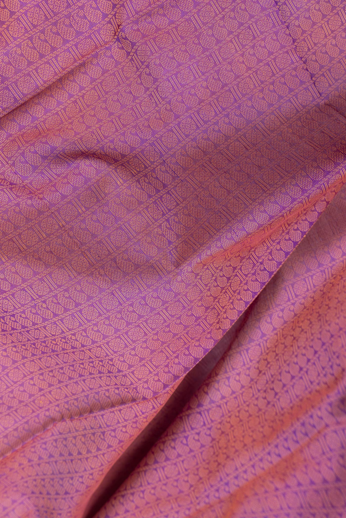 Close up of Purple Dual Tone Cotton Saree with Jacquard design on the body and Thread Border.  displaying folds