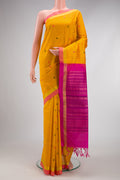 Yellow Silk Cotton Saree with Stripes on the body and Zari Border.  displayed on a mannequin
