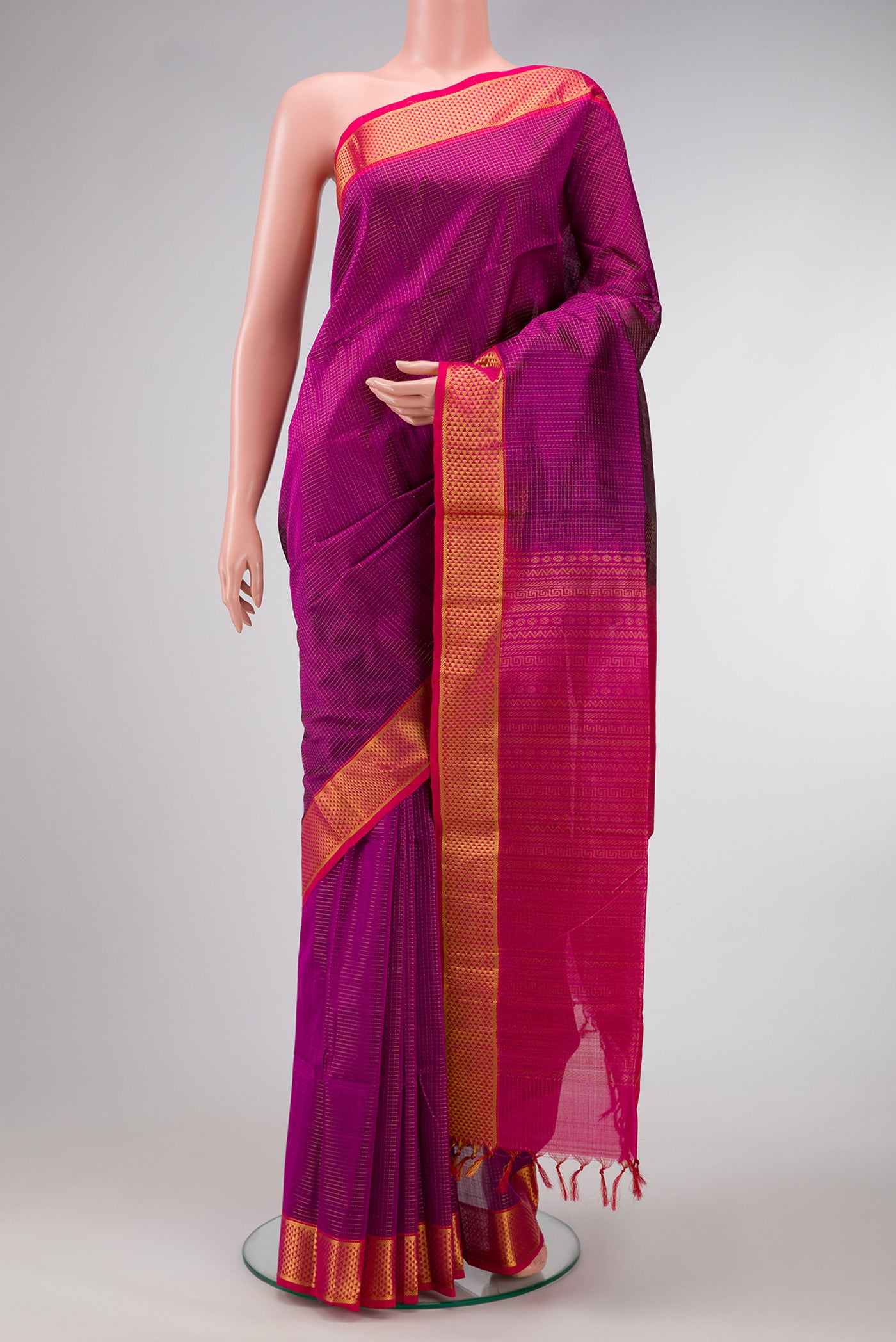 Magenta Dual Tone Silk Cotton Saree with Checked design on the body and Zari Border.  displayed on a mannequin