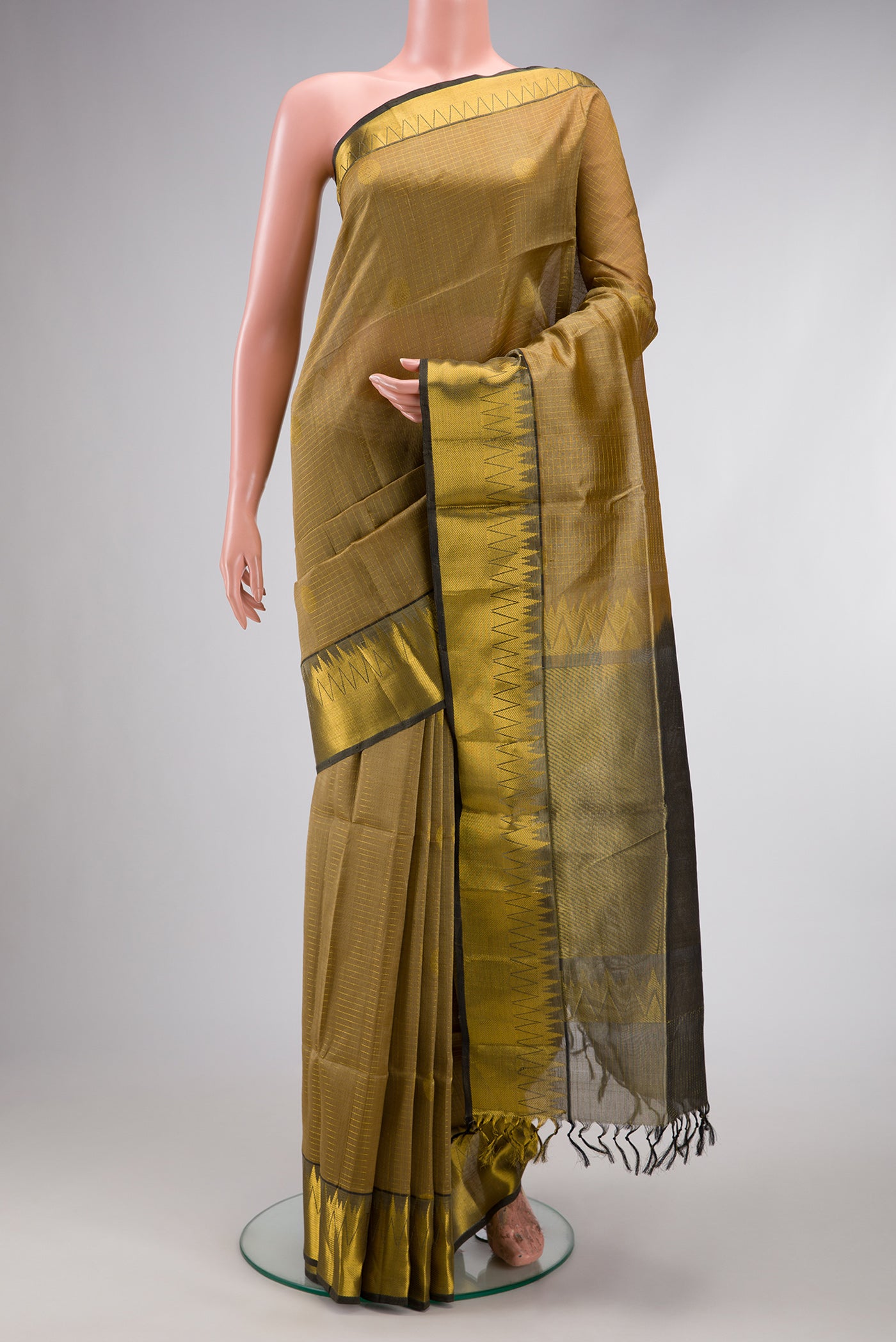 Beige Silk Cotton Saree with Checked design on the body and Zari Border.  displayed on a mannequin