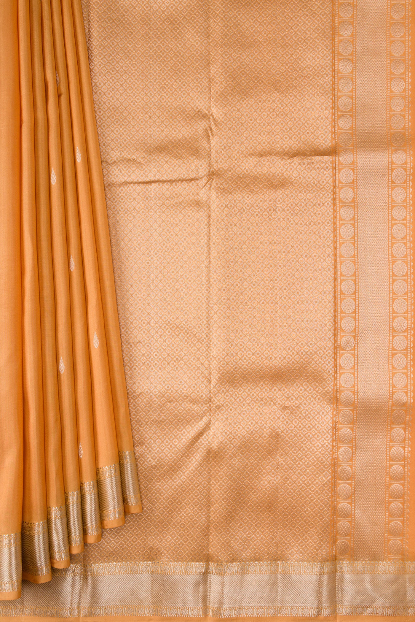 Pleats and pallu of Sandal Dual Tone Kanchipuram Silk Saree with Zari Butta on the body and Zari Border. 