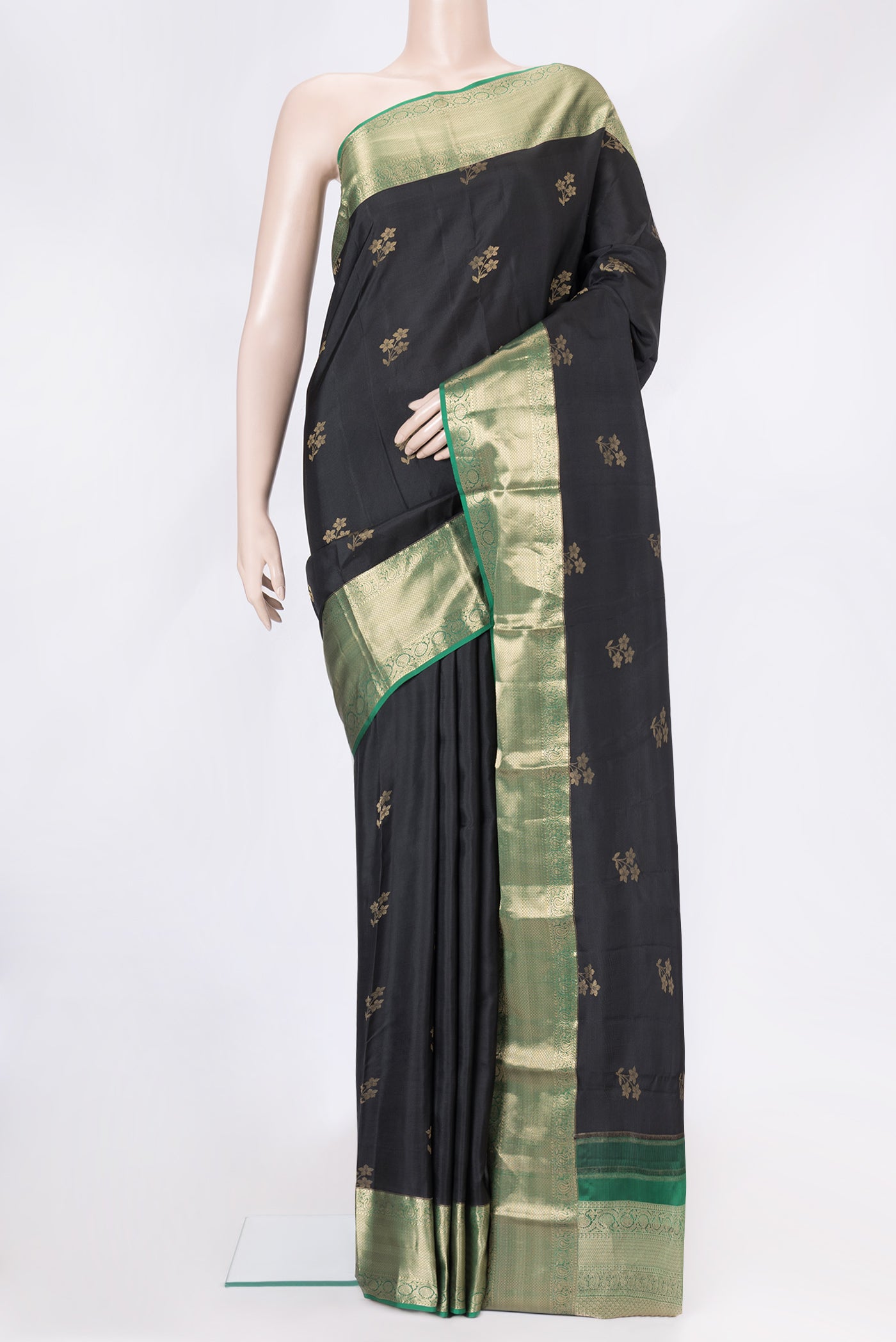 Black Dual Tone Kanjivaram Silk Saree with Zari Butta on the body and Zari Border.  displayed on a mannequin