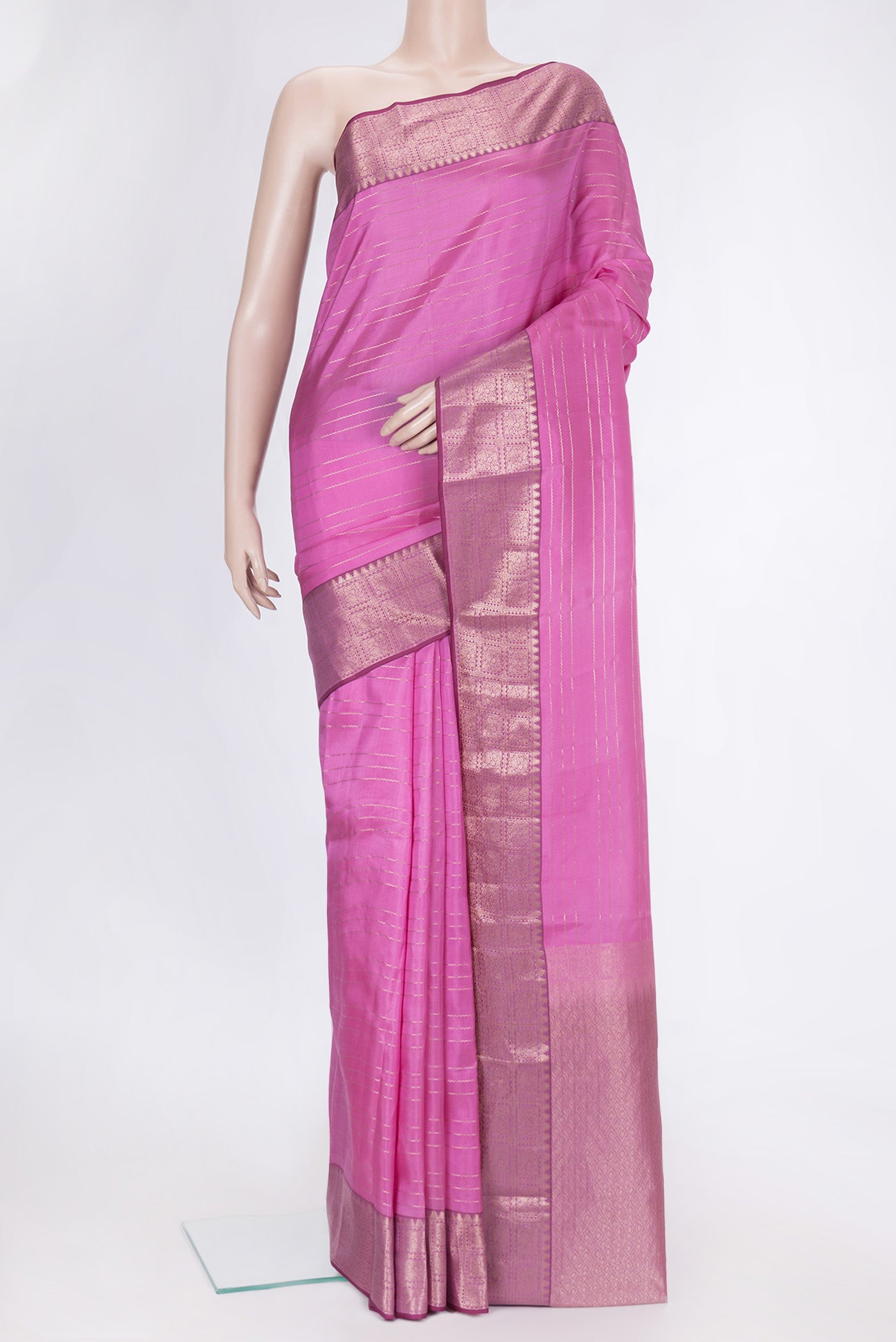 Pink Dual Tone Kanchipuram Silk Saree with Stripes on the body and Zari Border.  displayed on a mannequin