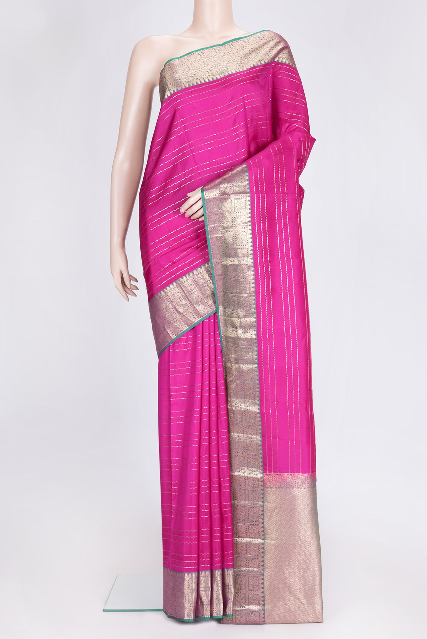 Pink Dual Tone Kanchipuram Silk Saree with Stripes on the body and Zari Border.  displayed on a mannequin
