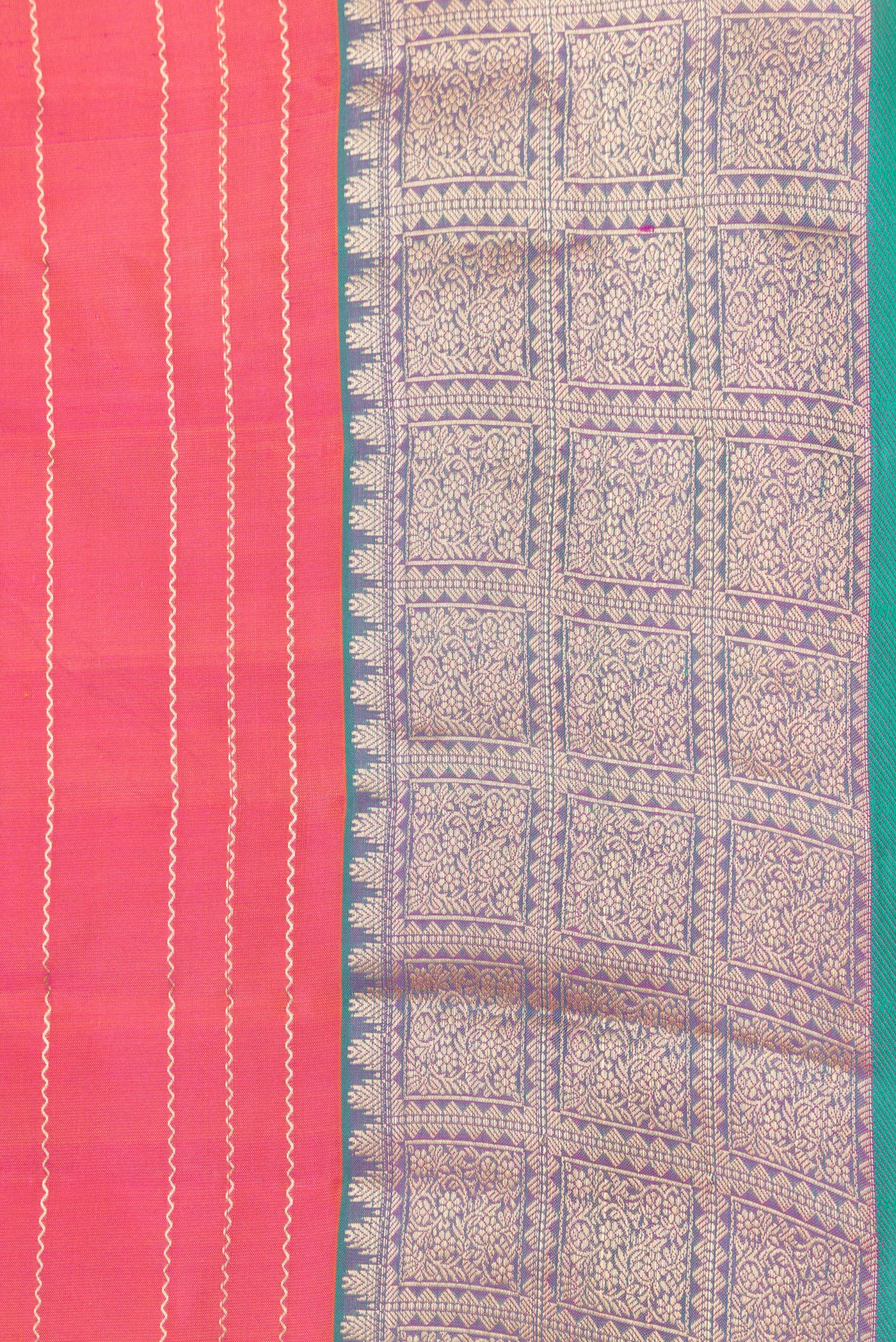 Border image of Orange Dual Tone Kanchipuram Silk Saree with Stripes on the body and Zari Border. 